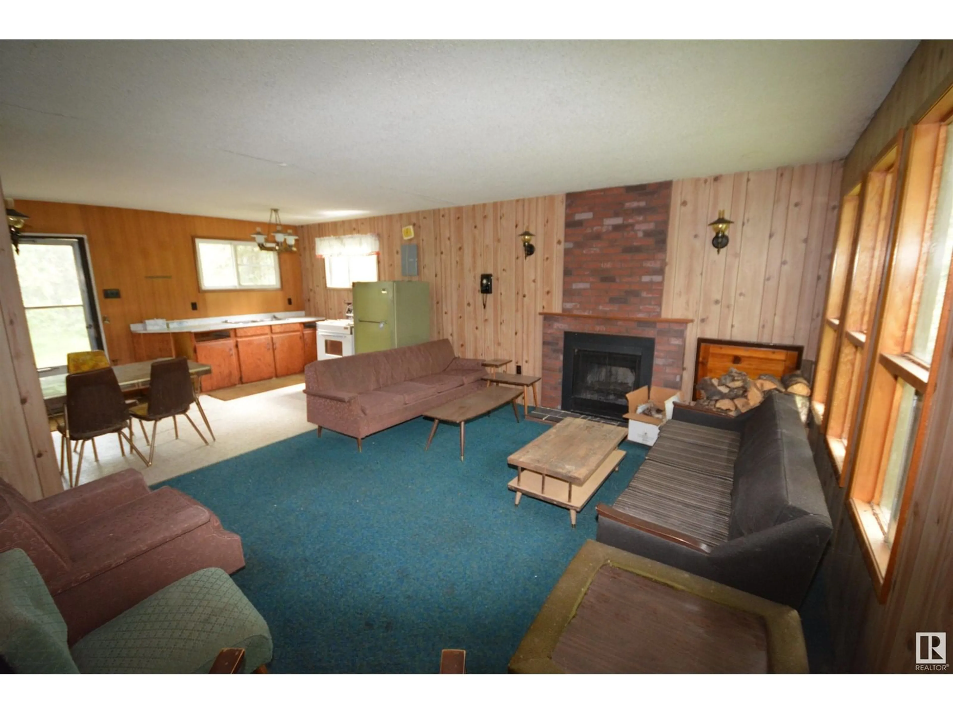 Living room with furniture, wood/laminate floor for 5073 5TH ST, Rural Lac Ste. Anne County Alberta T0E1V0