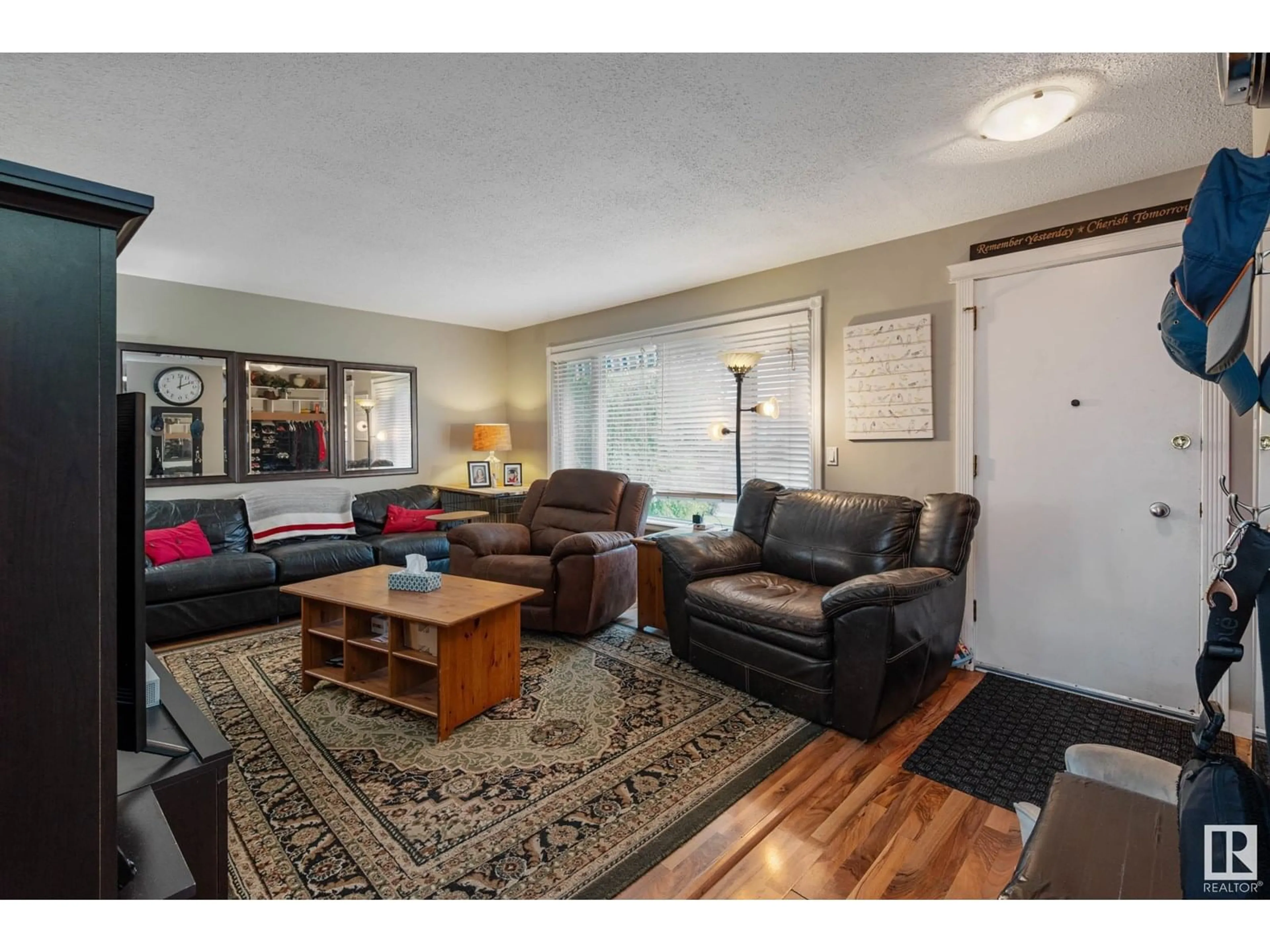 Living room with furniture, wood/laminate floor for NW - 5407 114B ST, Edmonton Alberta T6H3N6