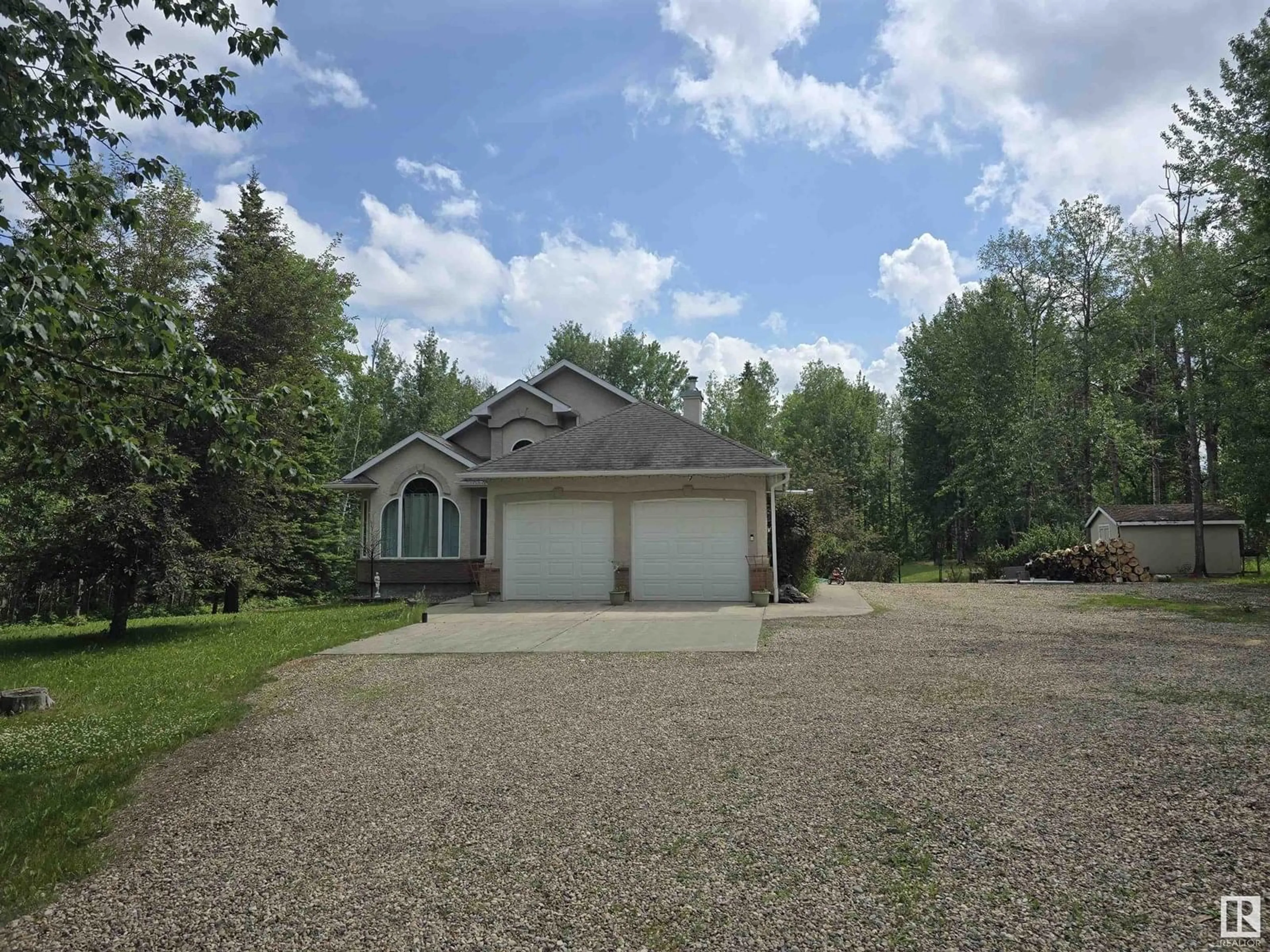 A pic from outside/outdoor area/front of a property/back of a property/a pic from drone, street for #302 - 49006 RGE ROAD 73, Rural Brazeau County Alberta T7A2A2