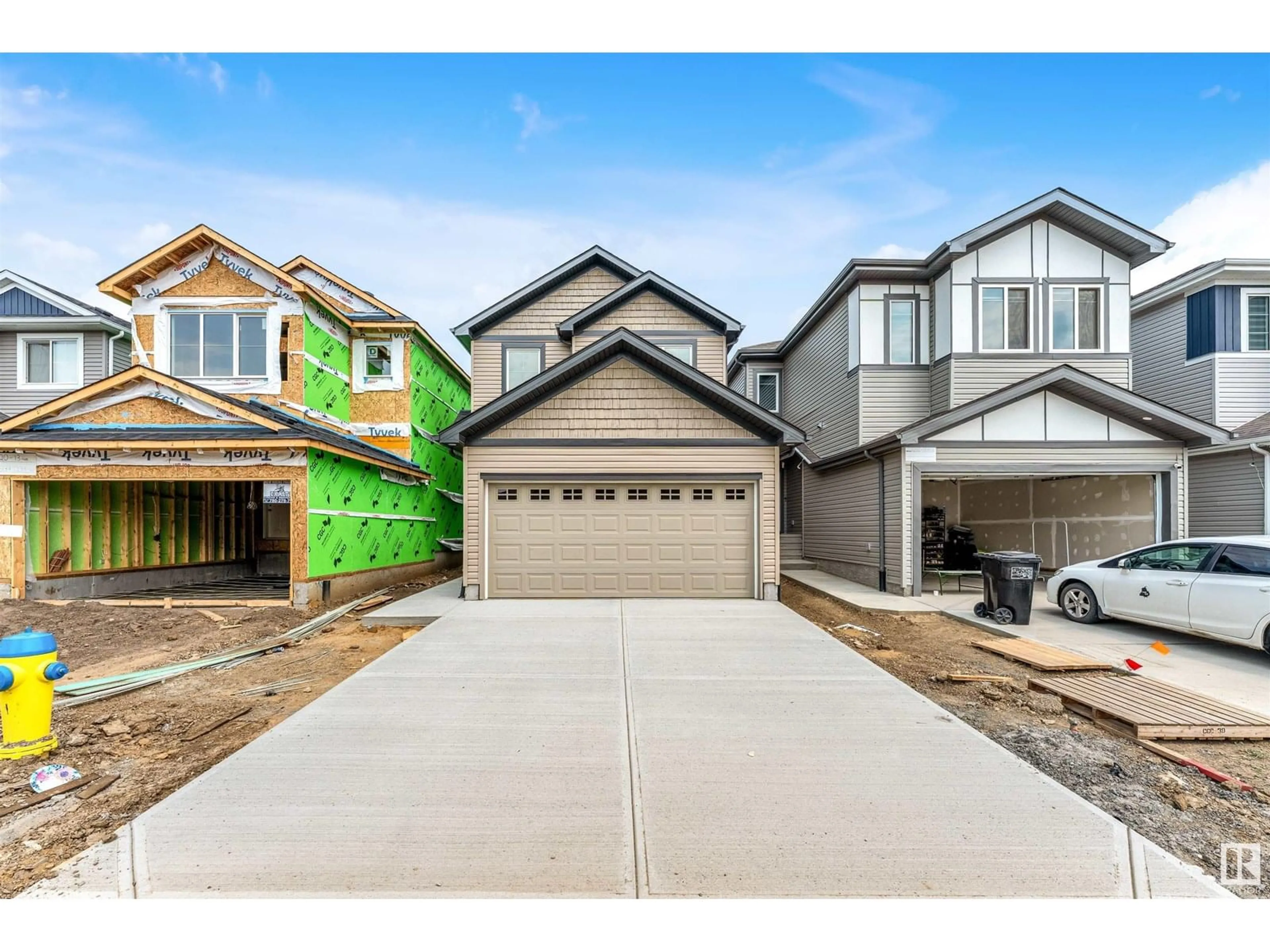 Home with vinyl exterior material, street for 1216 13 AVE NW, Edmonton Alberta T6T2W2