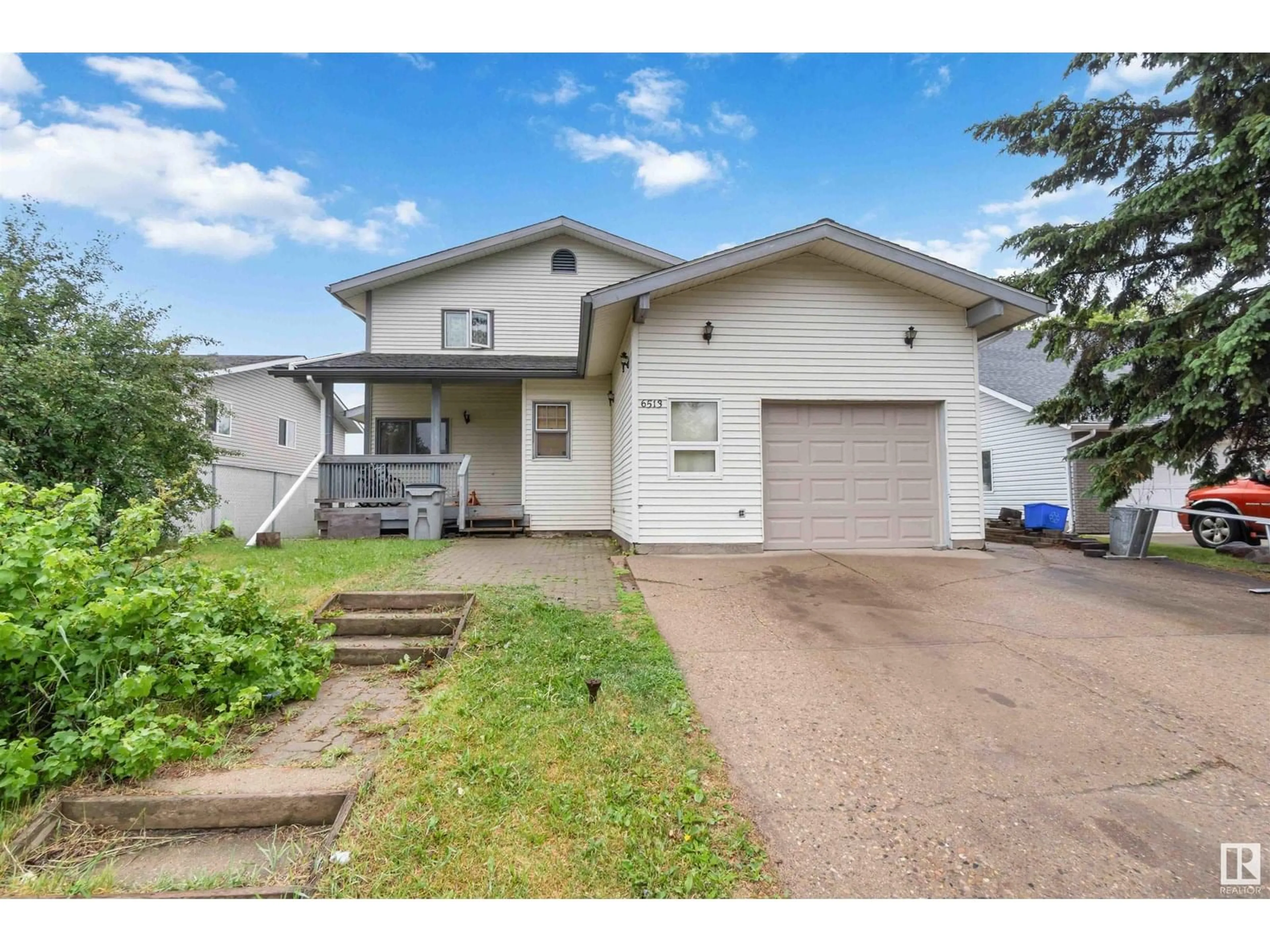 Home with vinyl exterior material, street for 6513 53 AV, Redwater Alberta T0A2W0