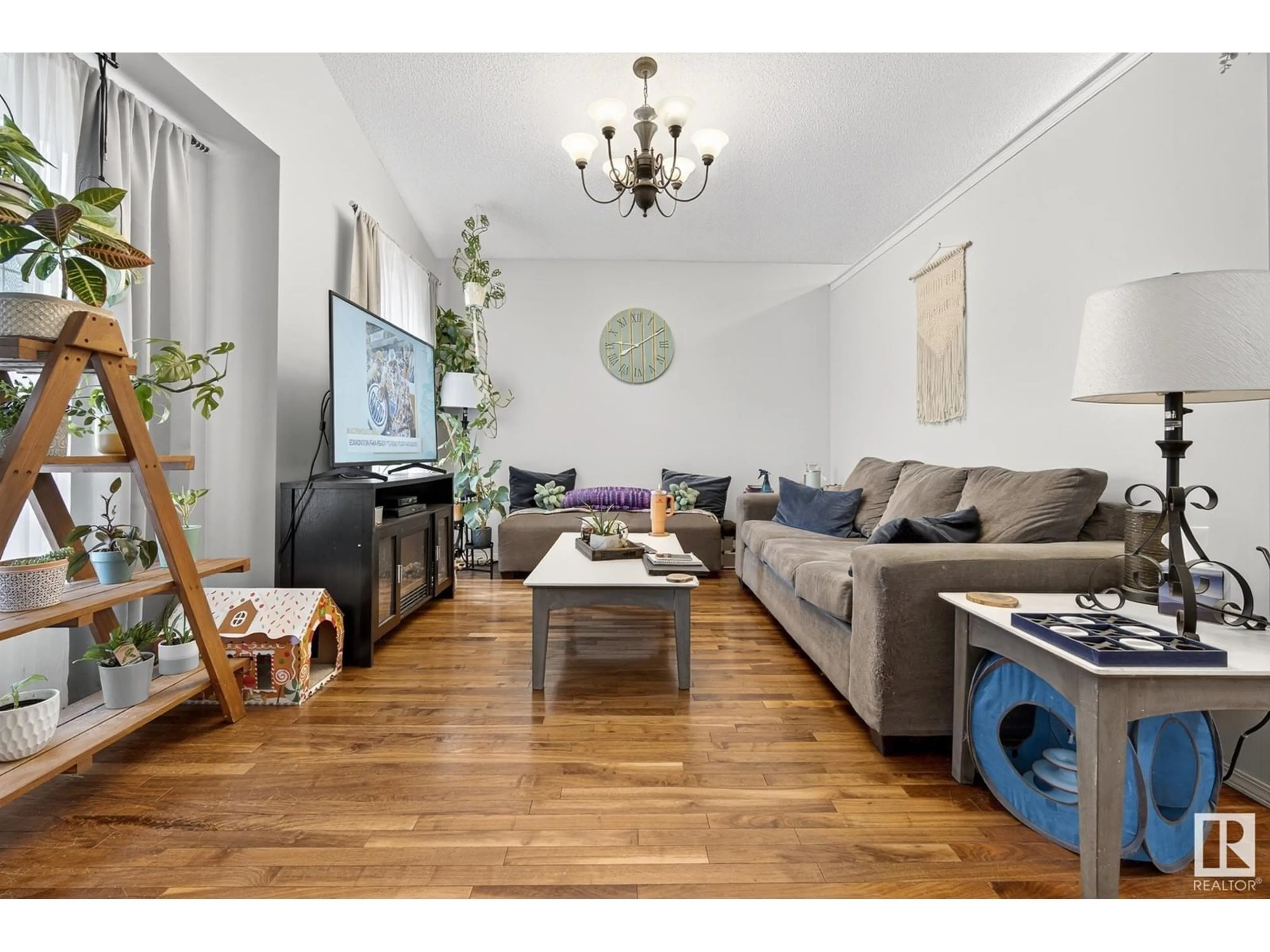 Living room with furniture, wood/laminate floor for 3021 TRELLE CR, Edmonton Alberta T6R3M8