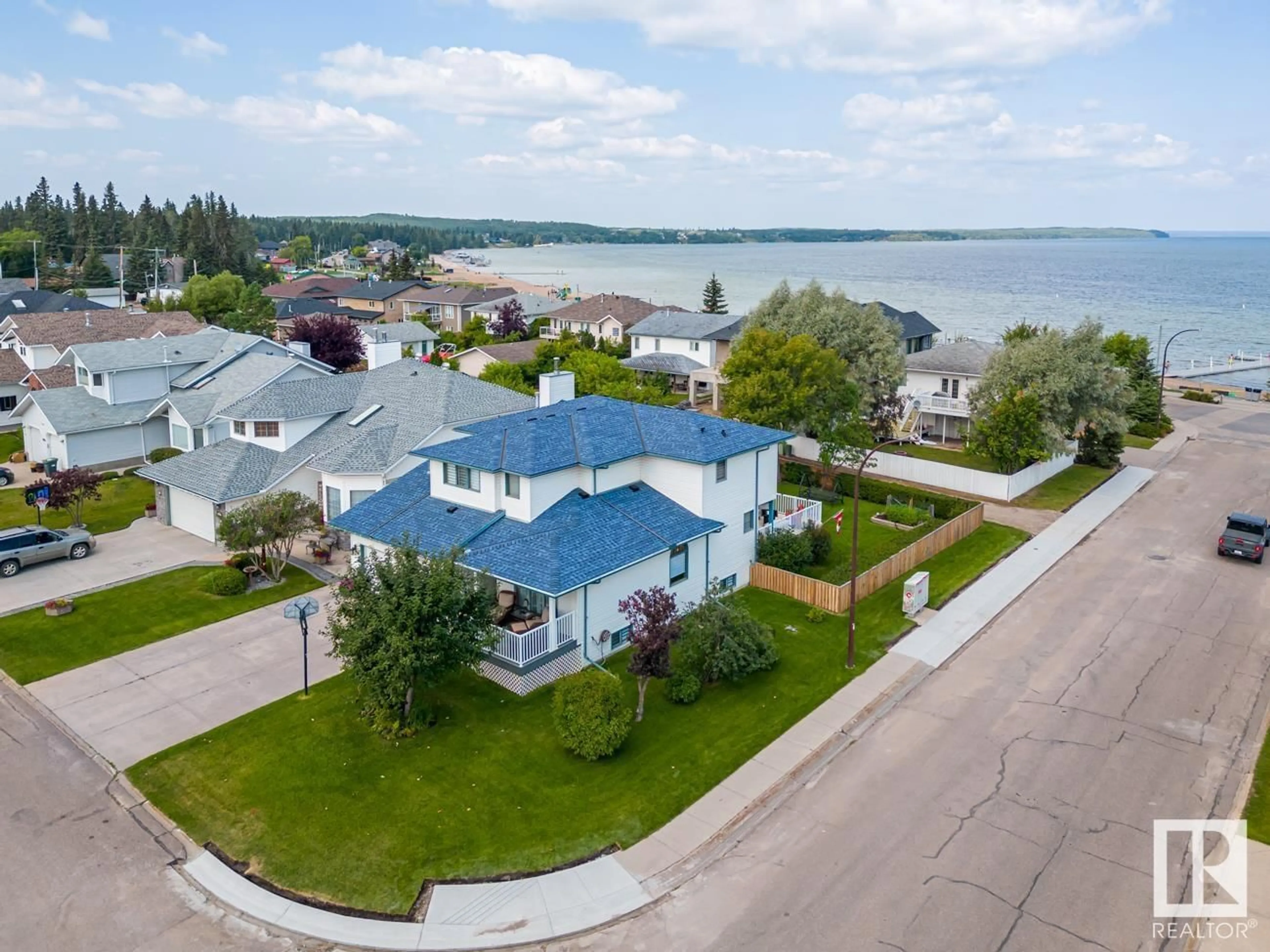 A pic from outside/outdoor area/front of a property/back of a property/a pic from drone, water/lake/river/ocean view for 1802 2 AV, Cold Lake Alberta T9M1E3