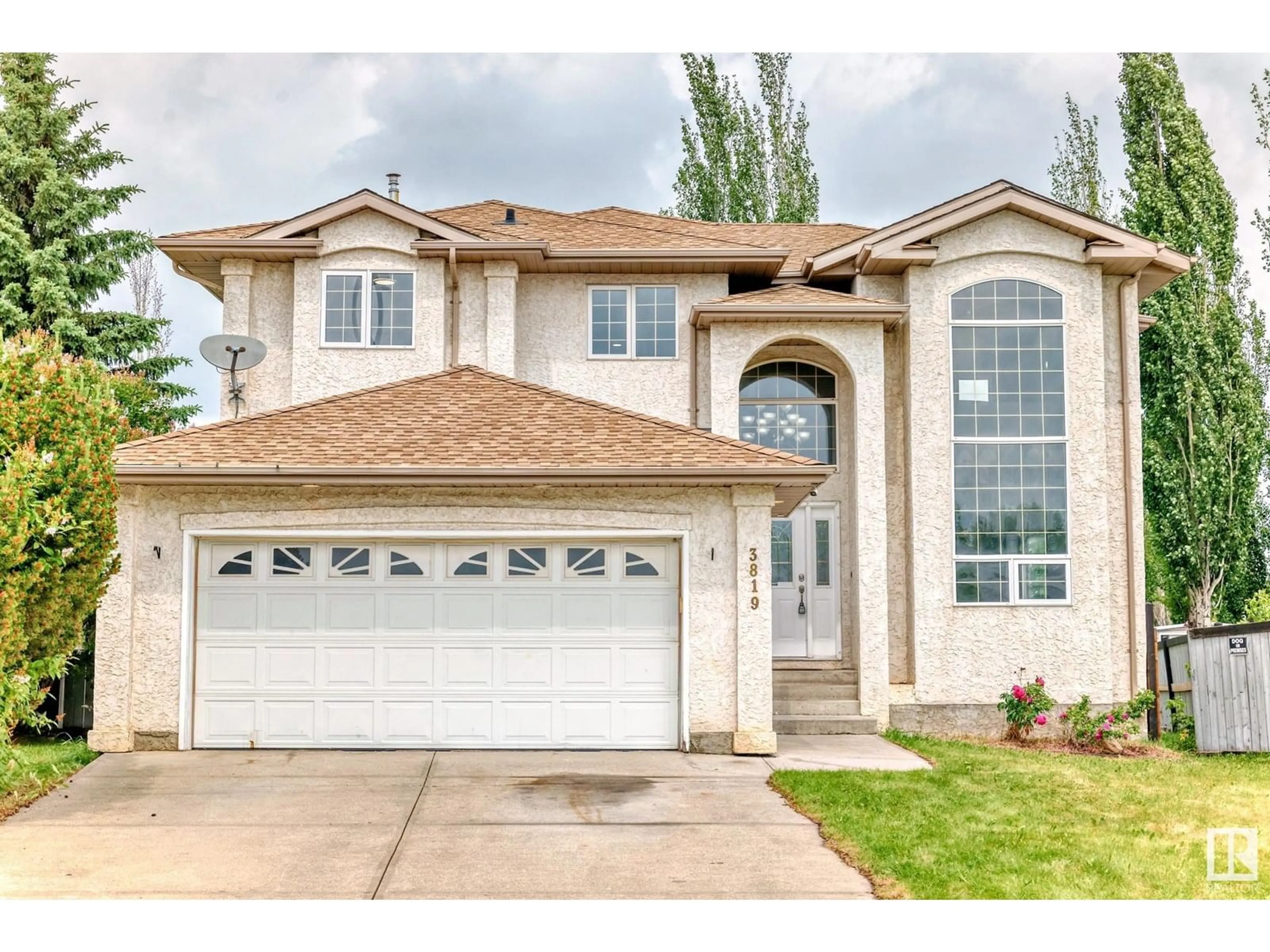 Home with vinyl exterior material, street for NW - 3819 42 ST, Edmonton Alberta T6L6Z6