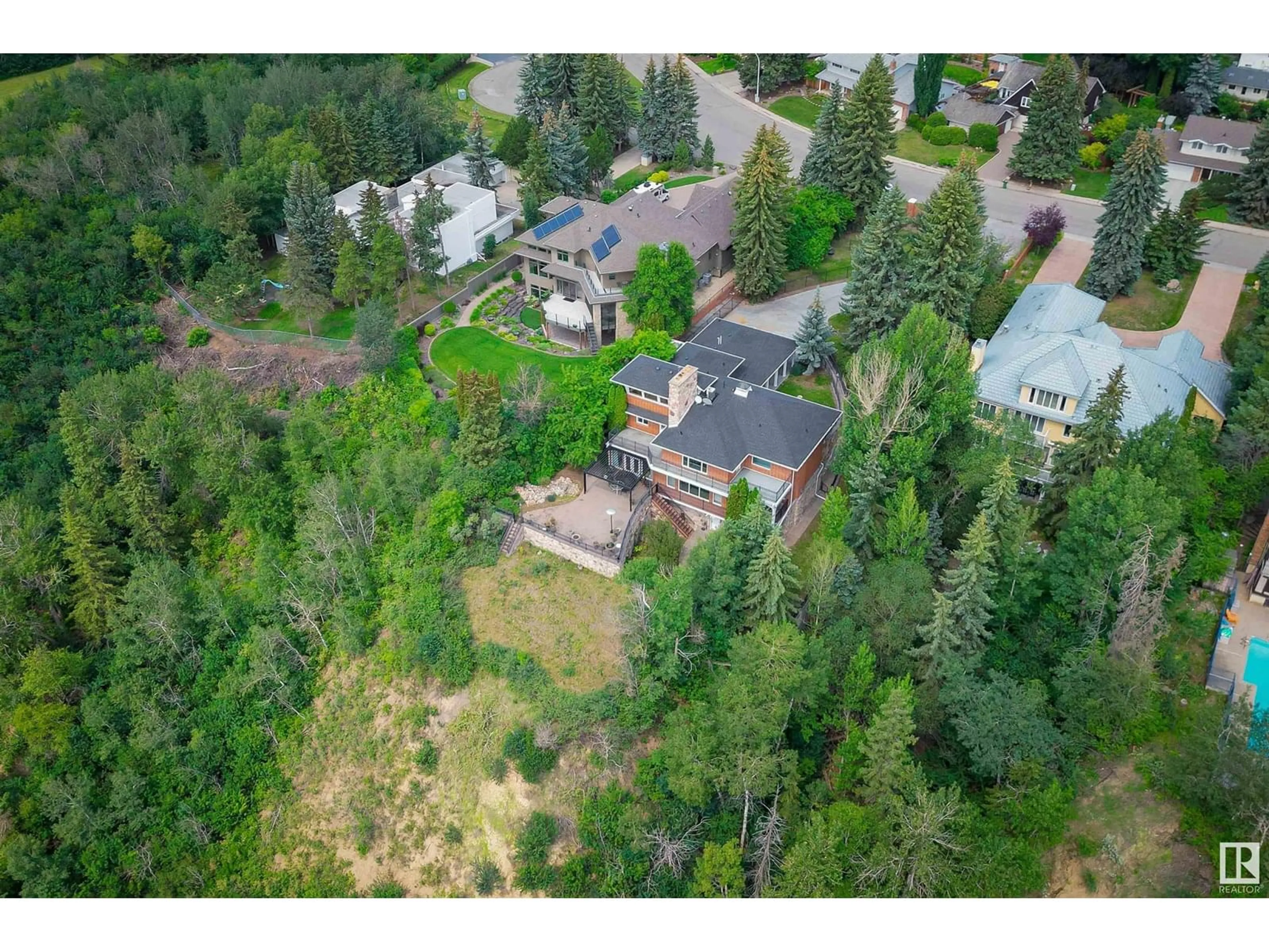 A pic from outside/outdoor area/front of a property/back of a property/a pic from drone, forest/trees view for 179 QUESNELL CR, Edmonton Alberta T5R5P1