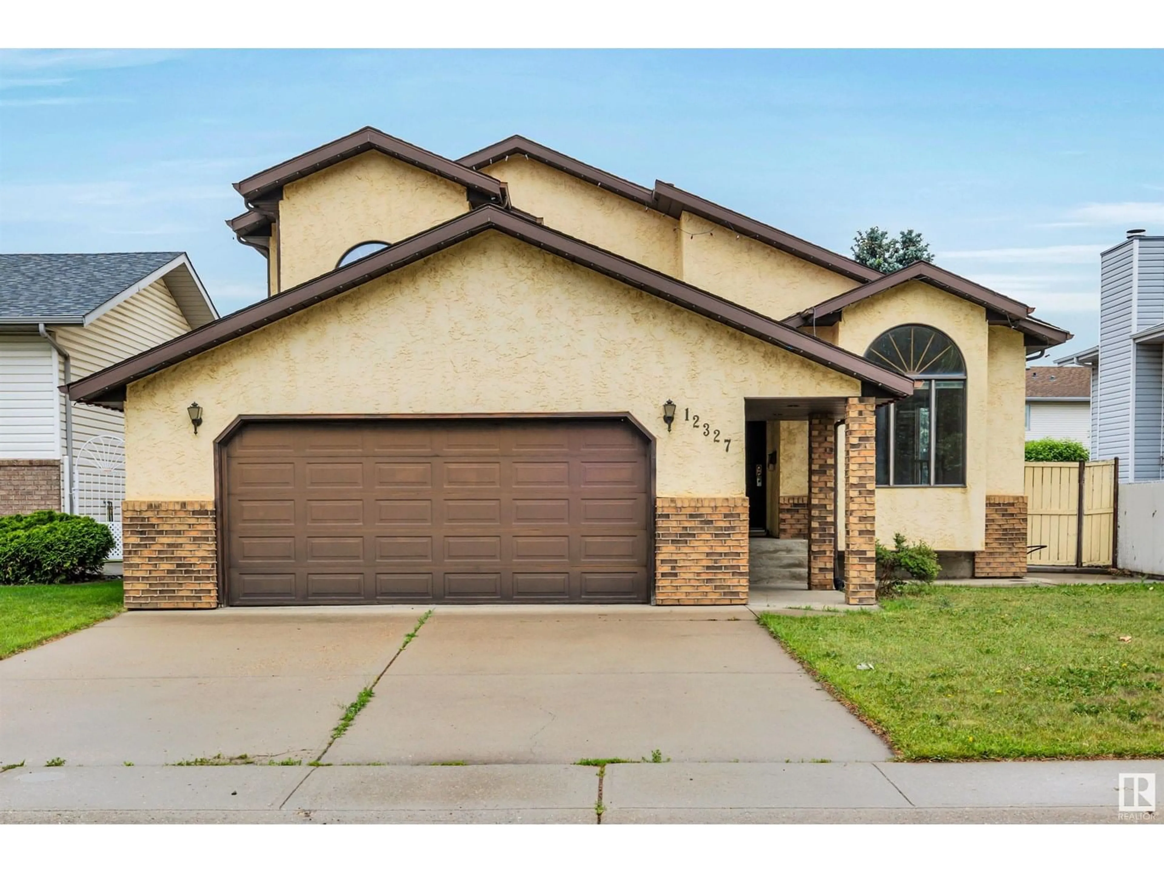 Home with brick exterior material, street for NW - 12327 57 ST, Edmonton Alberta T5W5E8