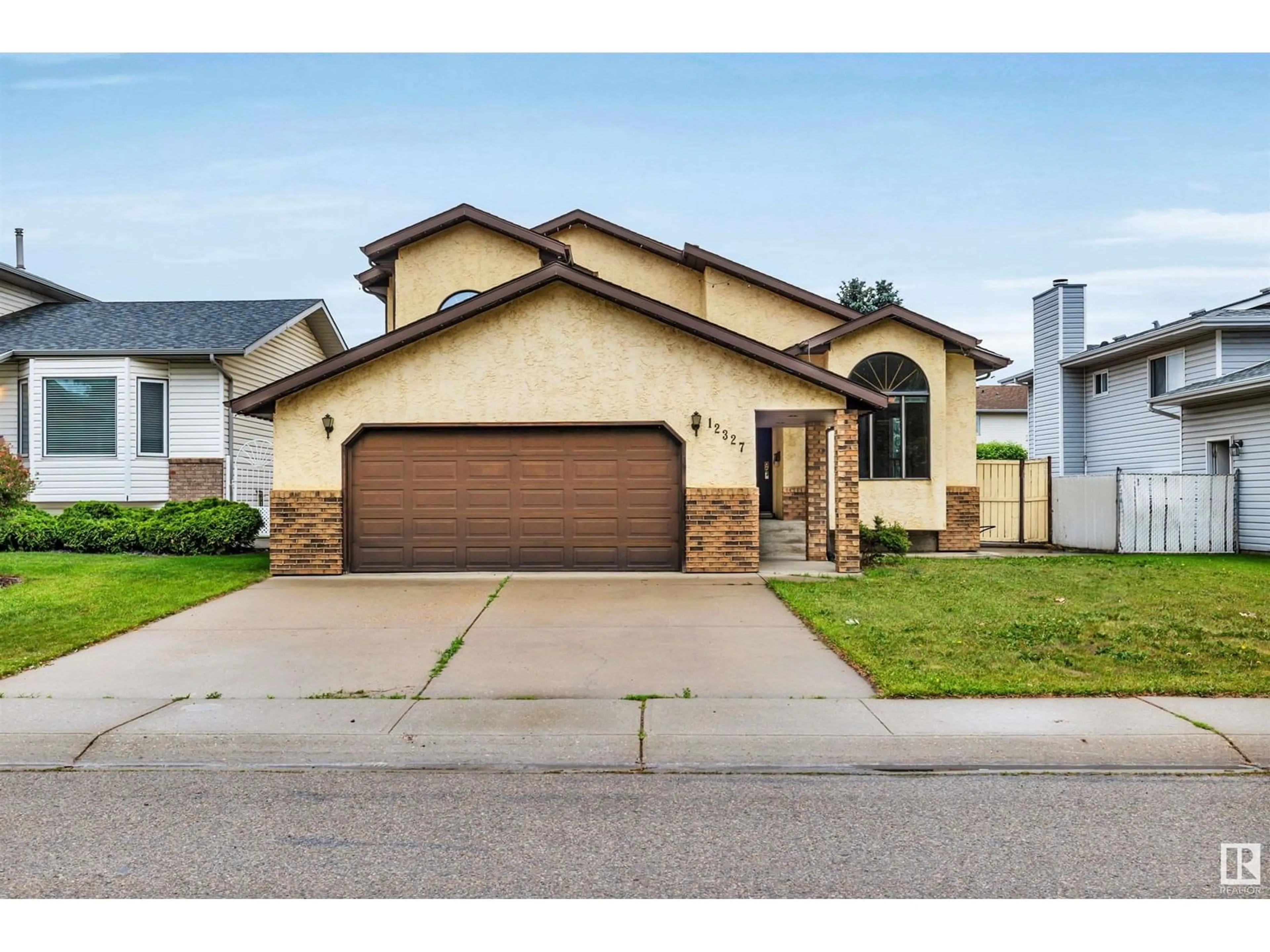 Home with brick exterior material, street for NW - 12327 57 ST, Edmonton Alberta T5W5E8