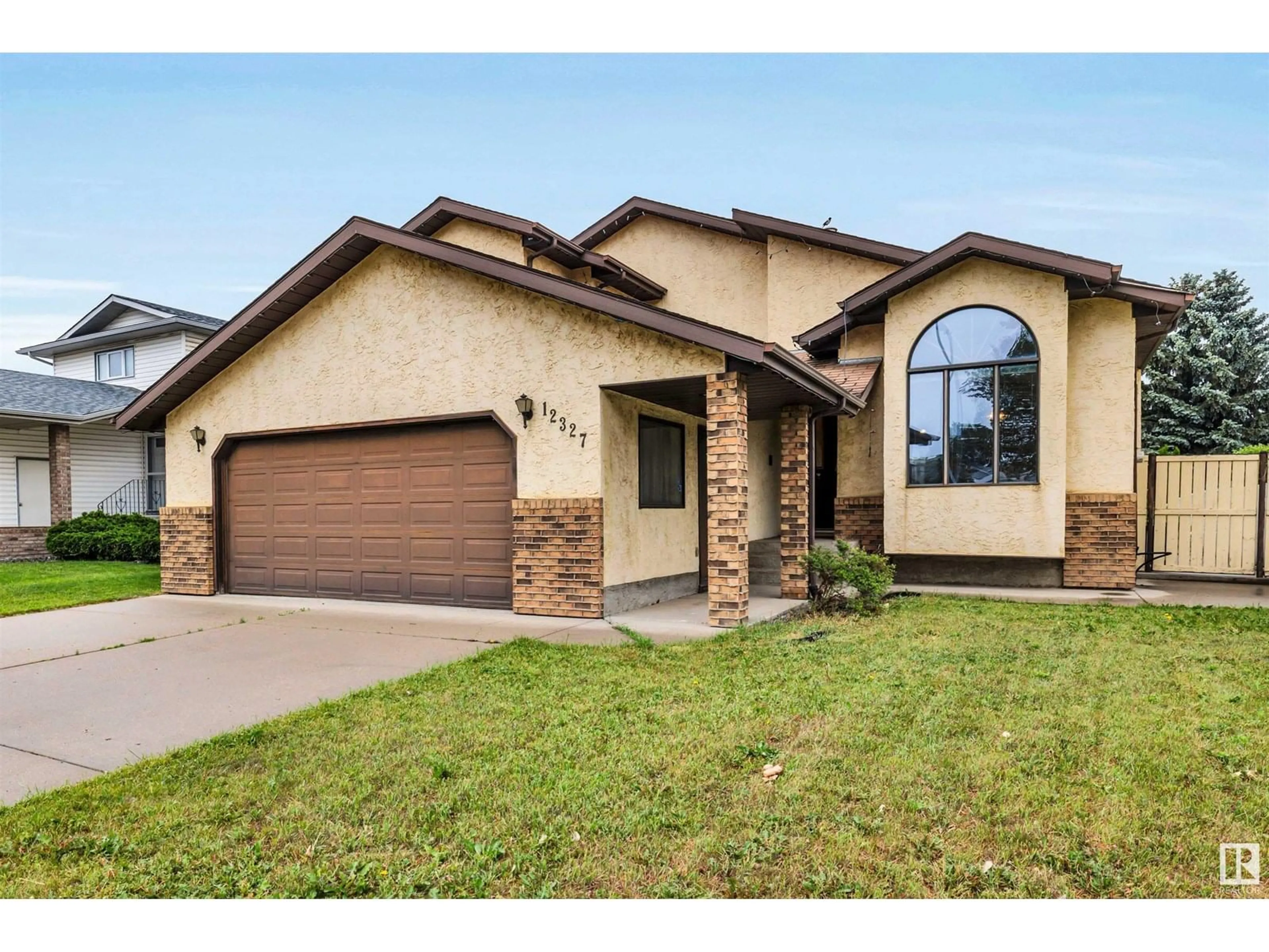 Home with brick exterior material, street for NW - 12327 57 ST, Edmonton Alberta T5W5E8