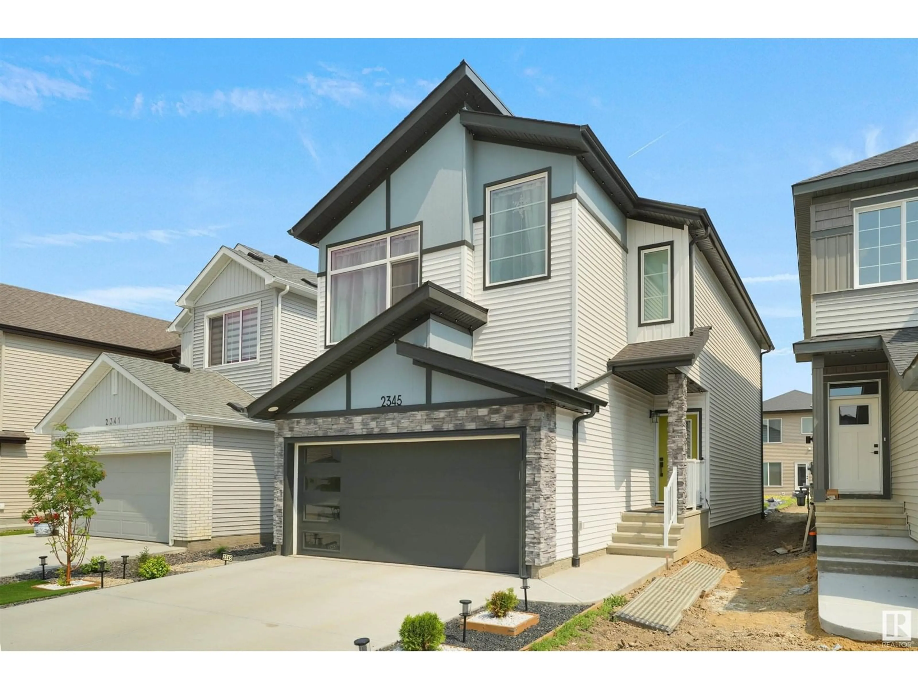 Home with vinyl exterior material, street for SW - 2345 158A ST, Edmonton Alberta T6W5K4