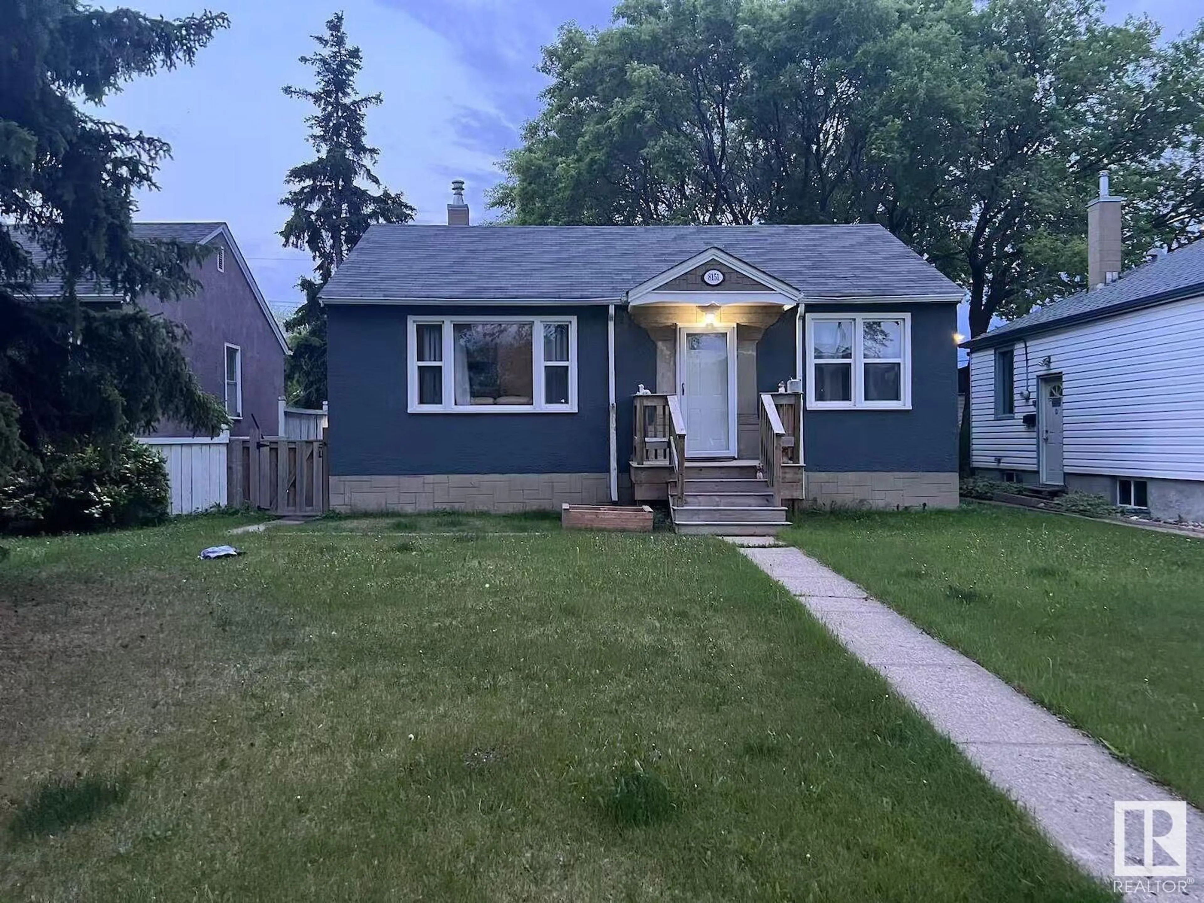 Home with vinyl exterior material, street for 8151 79 AV, Edmonton Alberta T6C0P9