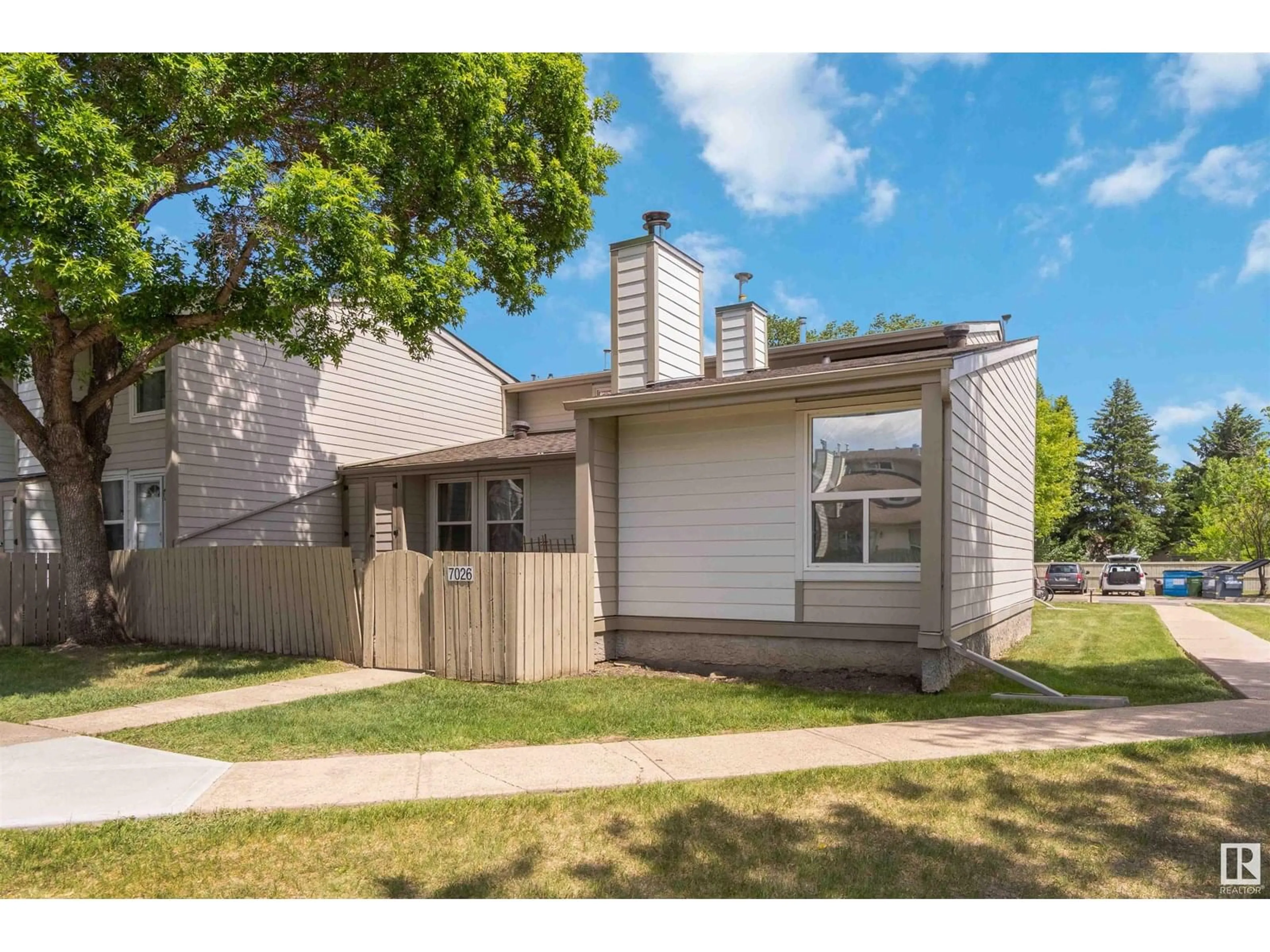 Home with vinyl exterior material, street for 7026 MILLWOODS RD, Edmonton Alberta T6K3M3