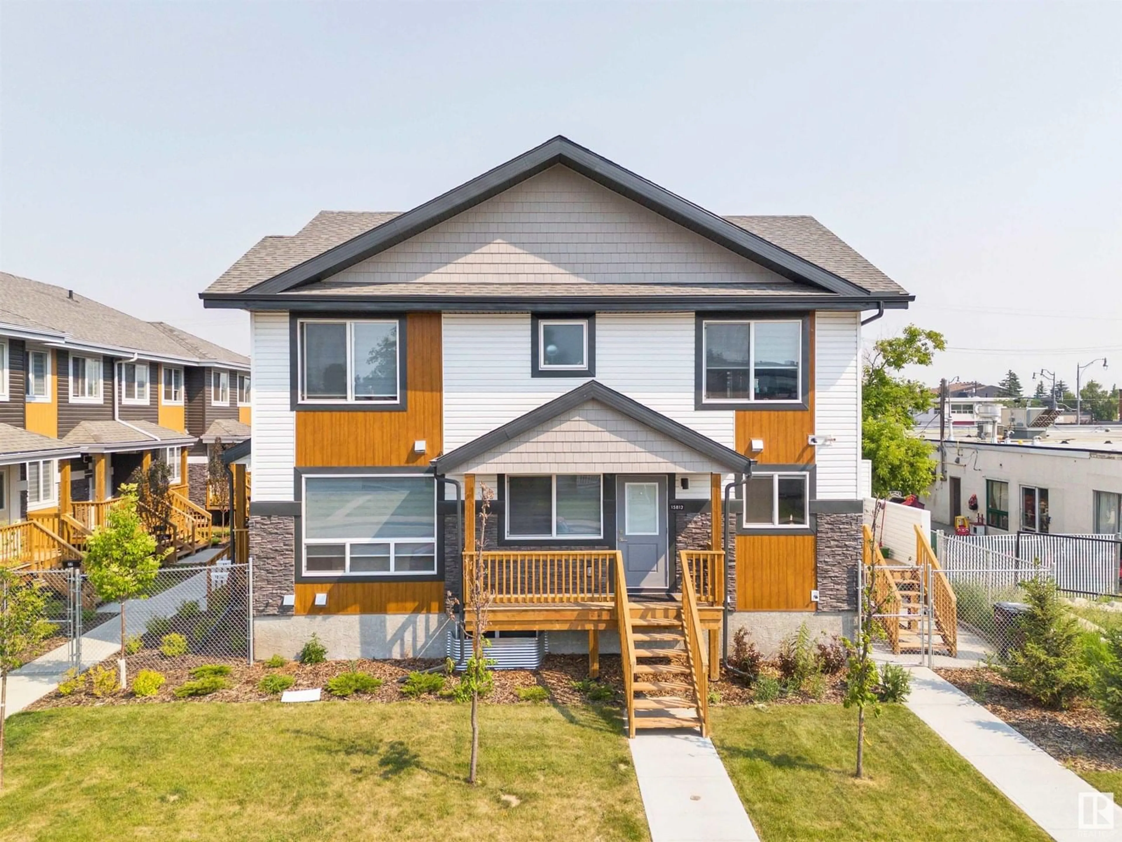 Home with vinyl exterior material, street for NW - 15812 100A AV, Edmonton Alberta T5P0L8