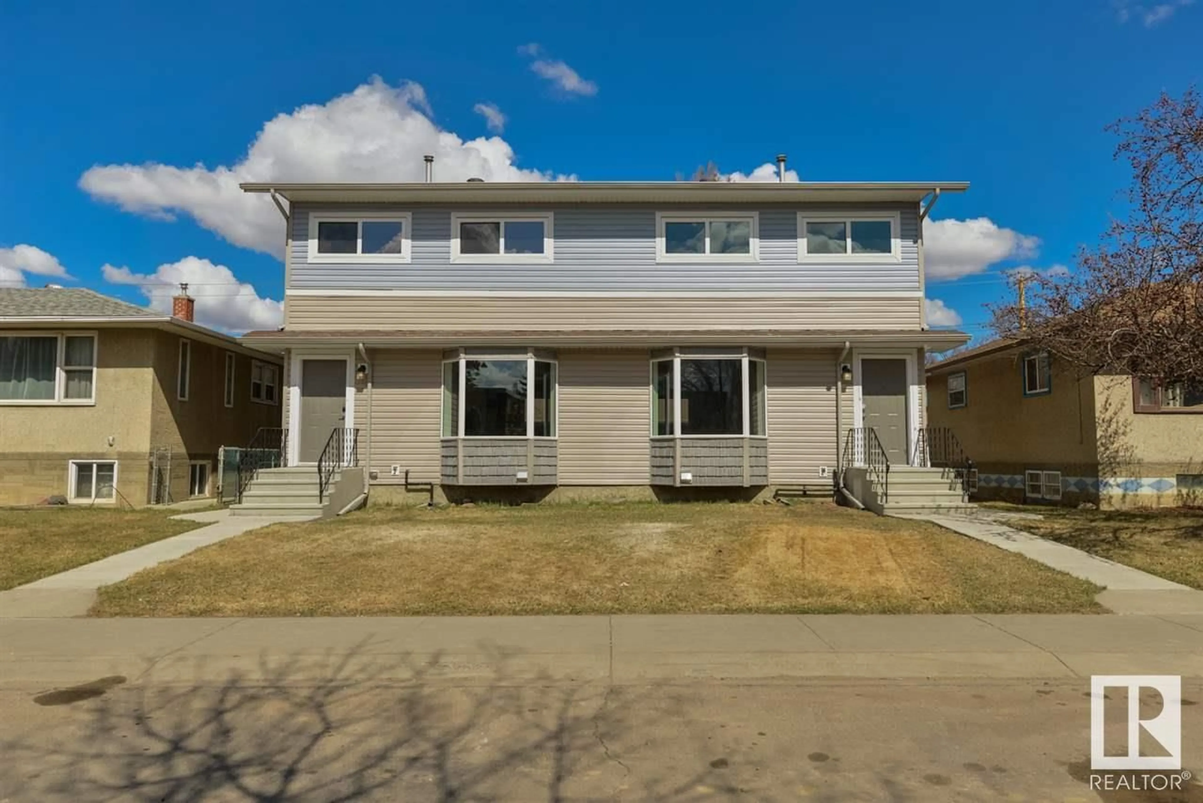 Home with vinyl exterior material, street for 7940/7942 82 AV, Edmonton Alberta T6C0Y2