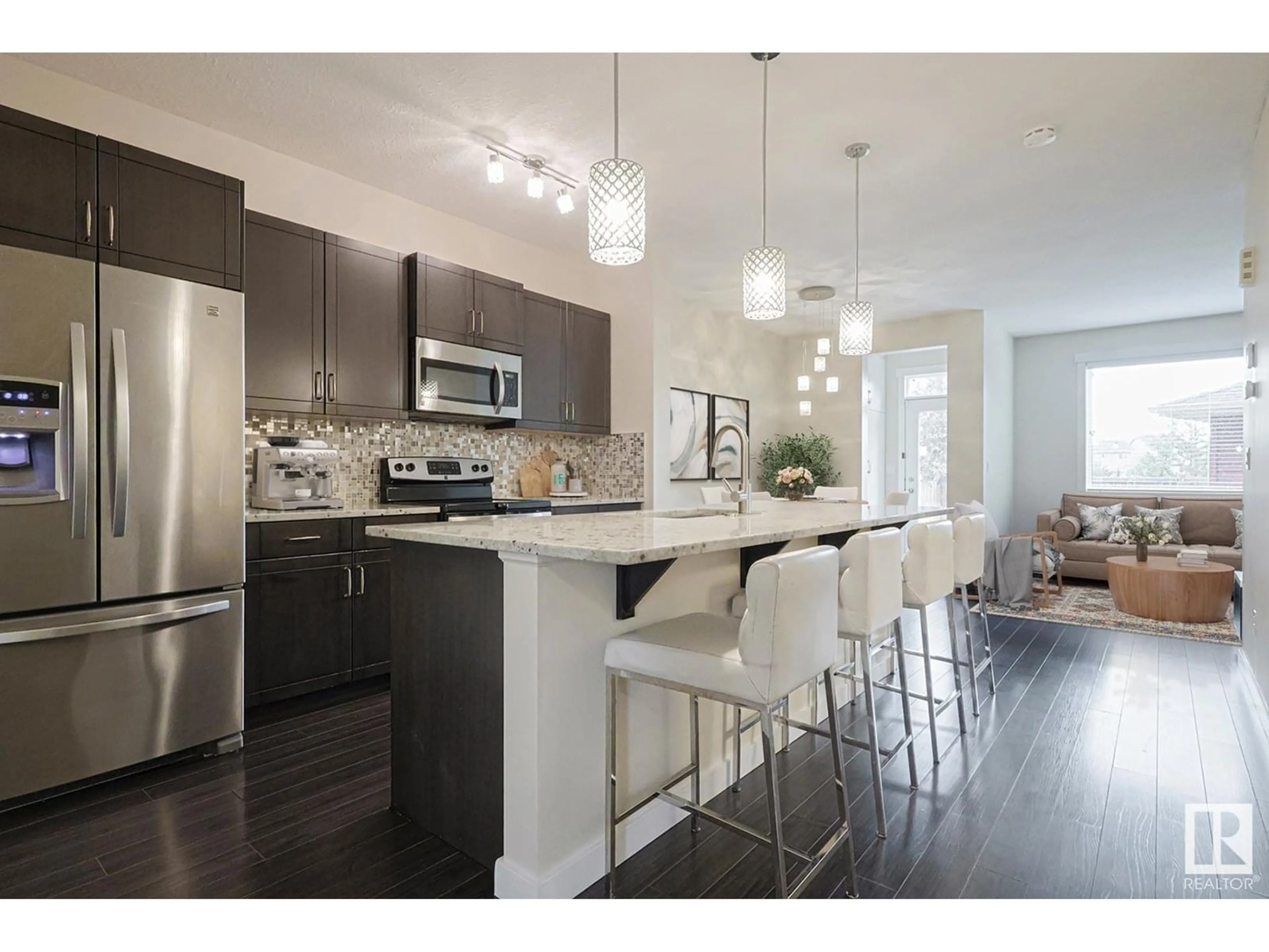 Open concept kitchen, wood/laminate floor for SW - 3438 CUTLER CR, Edmonton Alberta T6W2B3