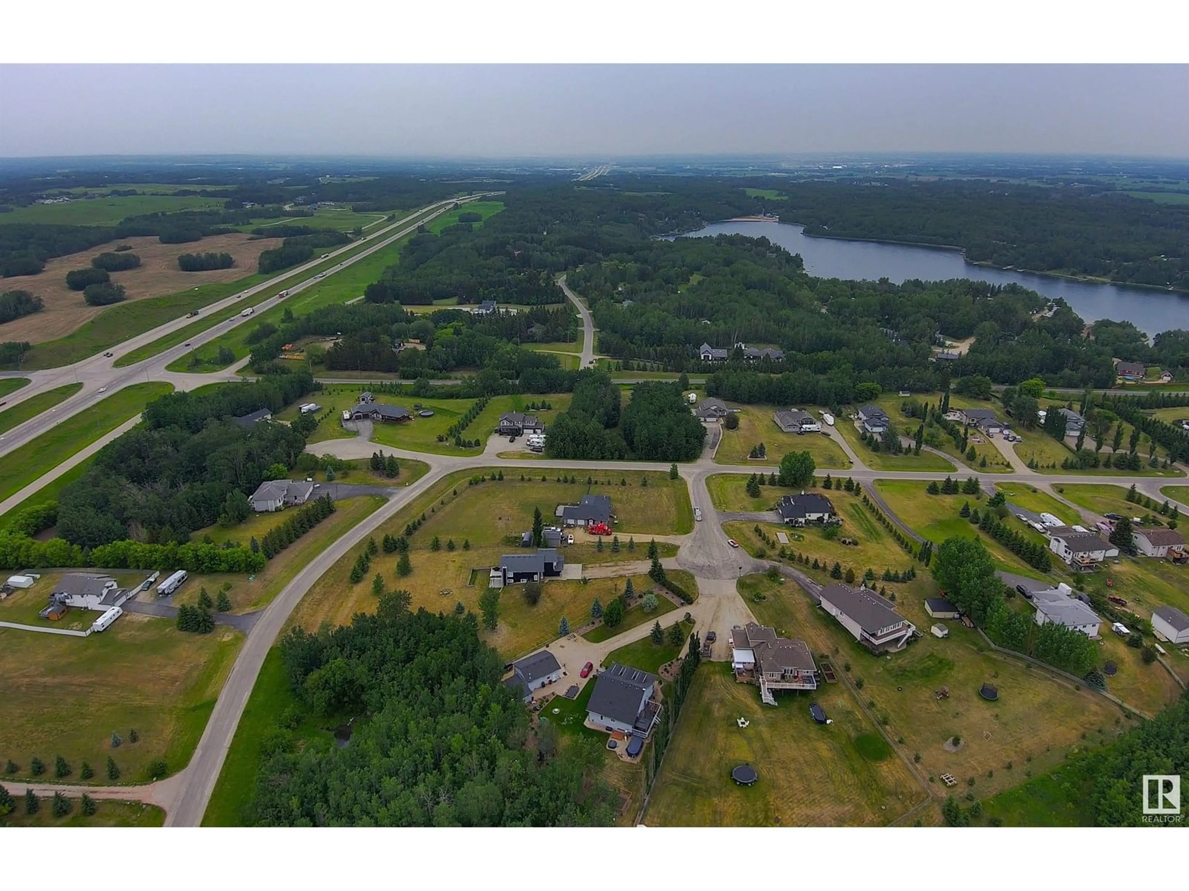 A pic from outside/outdoor area/front of a property/back of a property/a pic from drone, water/lake/river/ocean view for 53122 - 22 RGE ROAD 14, Rural Parkland County Alberta T7Y2T3