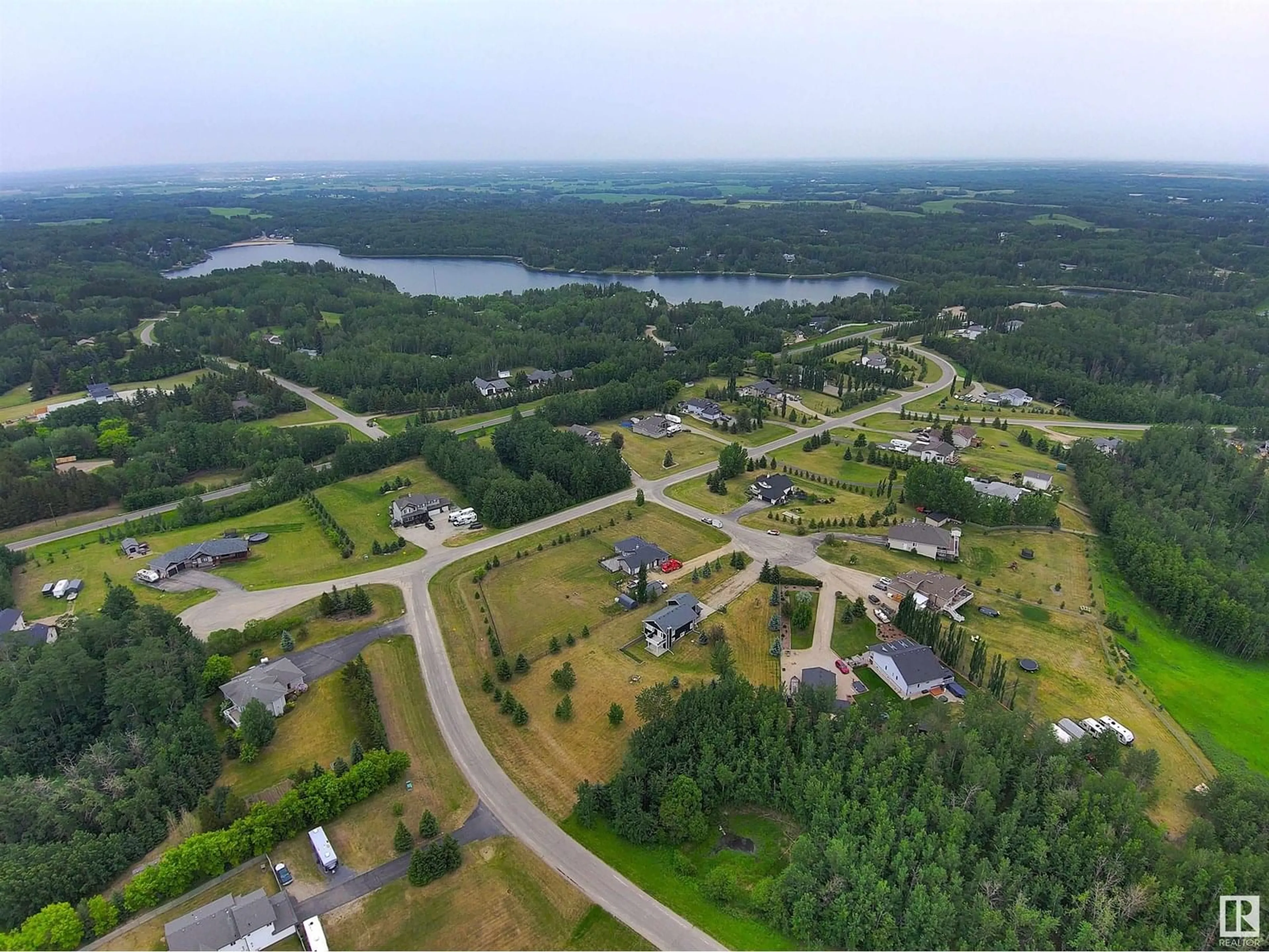 A pic from outside/outdoor area/front of a property/back of a property/a pic from drone, water/lake/river/ocean view for 53122 - 22 RGE ROAD 14, Rural Parkland County Alberta T7Y2T3