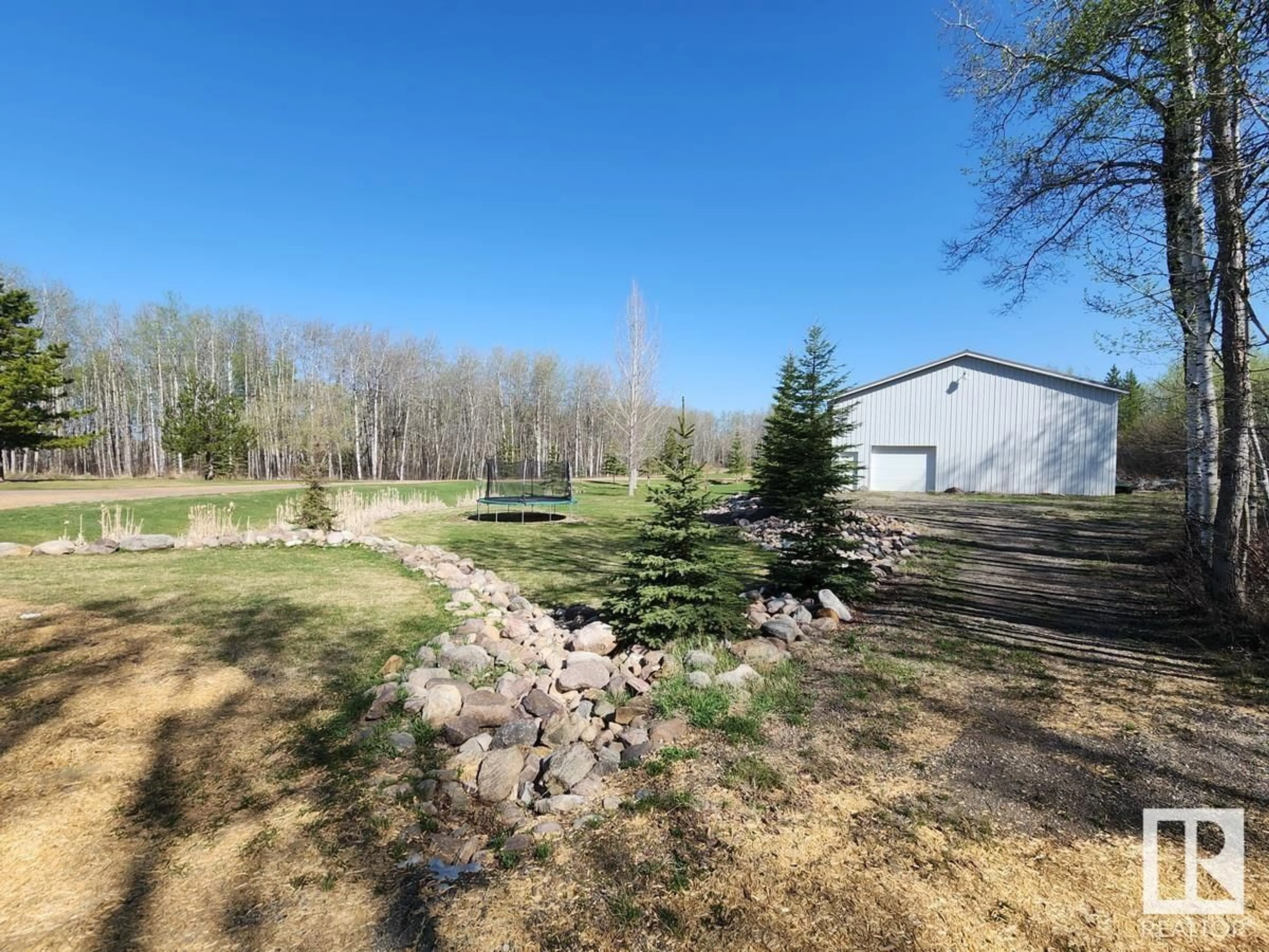 A pic from outside/outdoor area/front of a property/back of a property/a pic from drone, forest/trees view for 52510 - 61 RGE ROAD 213, Rural Strathcona County Alberta T8E2G6
