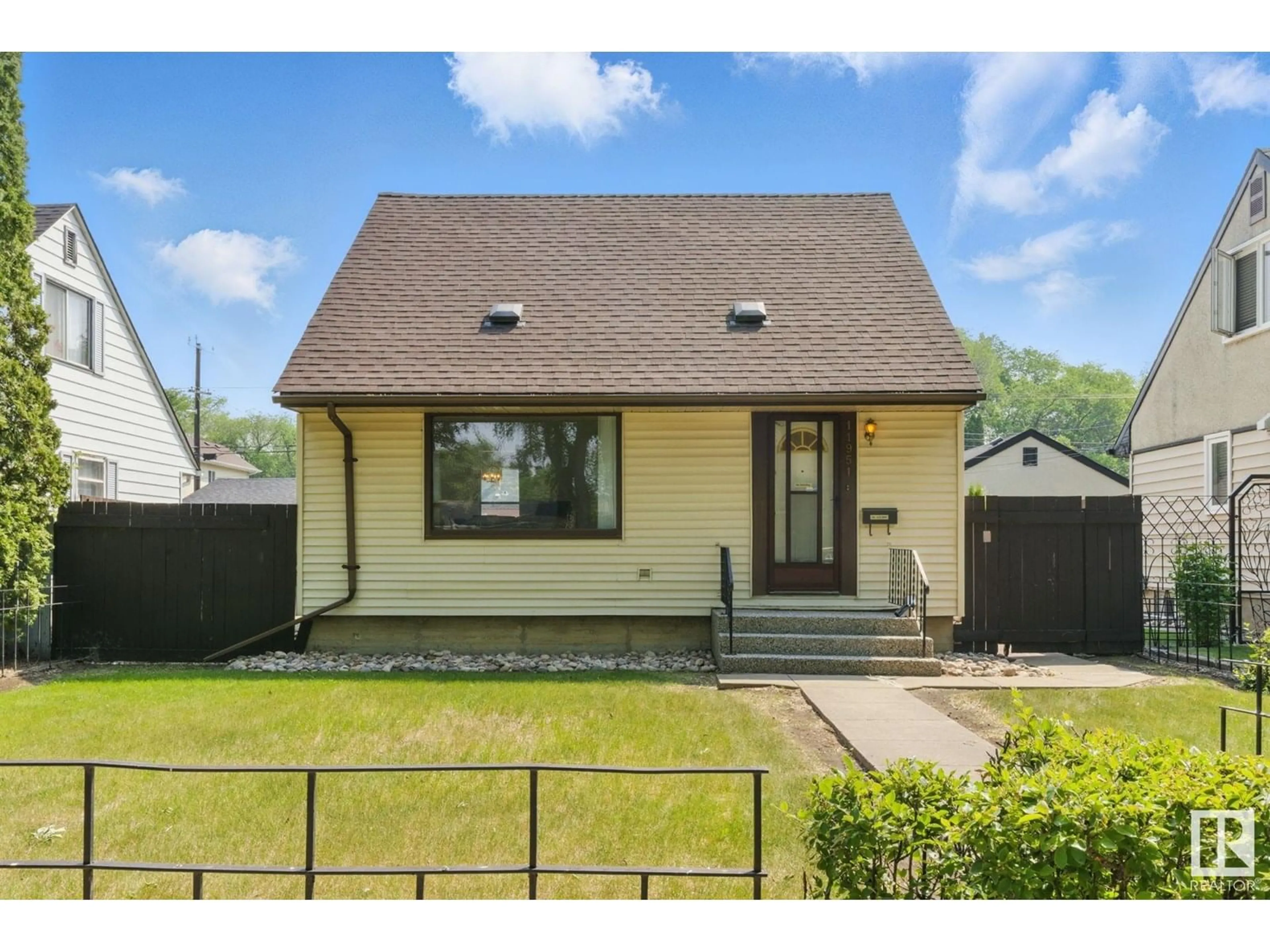 Home with vinyl exterior material, street for NW - 11951 59 ST, Edmonton Alberta T5W3X9