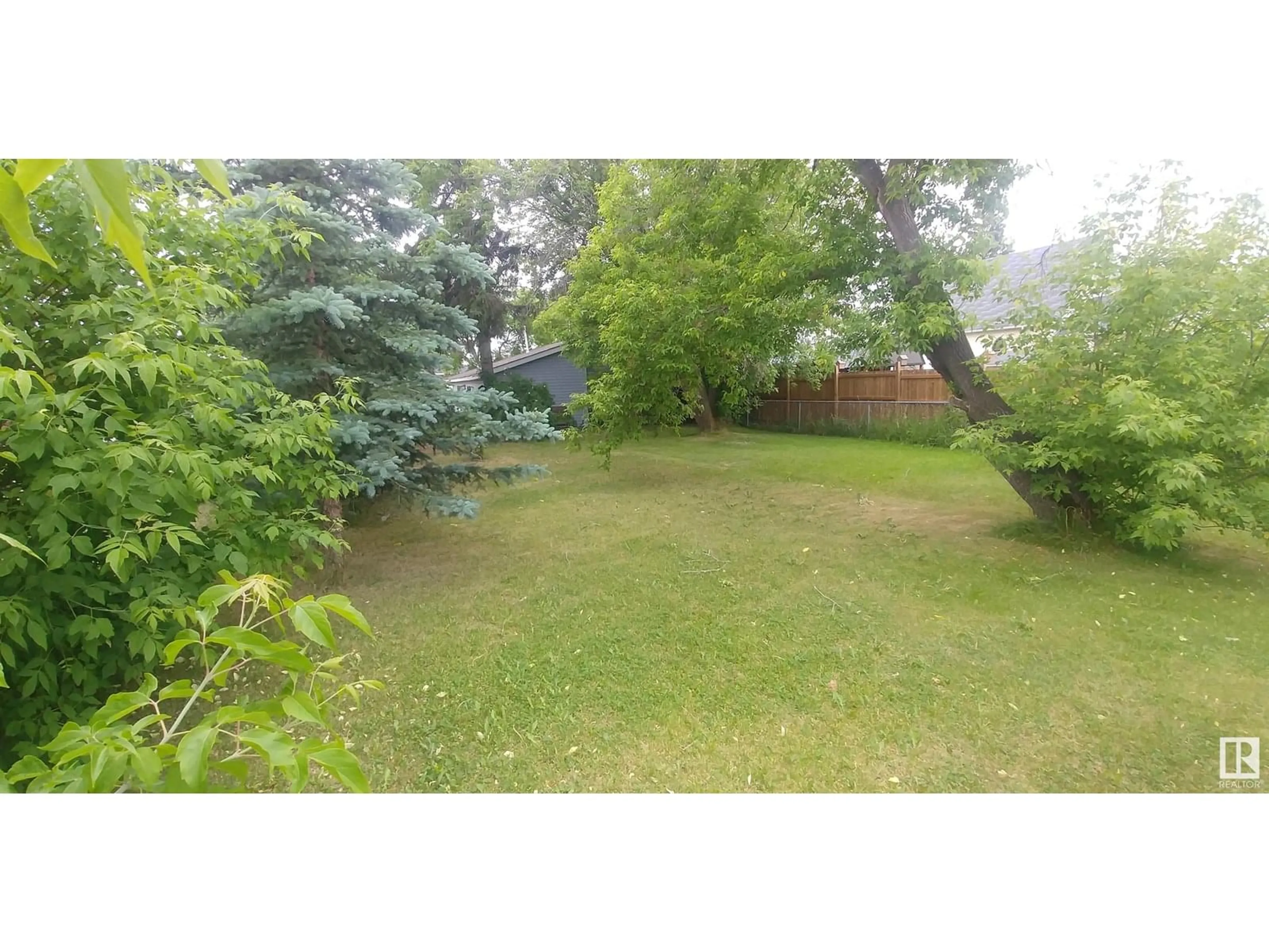 A pic from outside/outdoor area/front of a property/back of a property/a pic from drone, forest/trees view for 5012 49 AV, Millet Alberta T0C1Z0