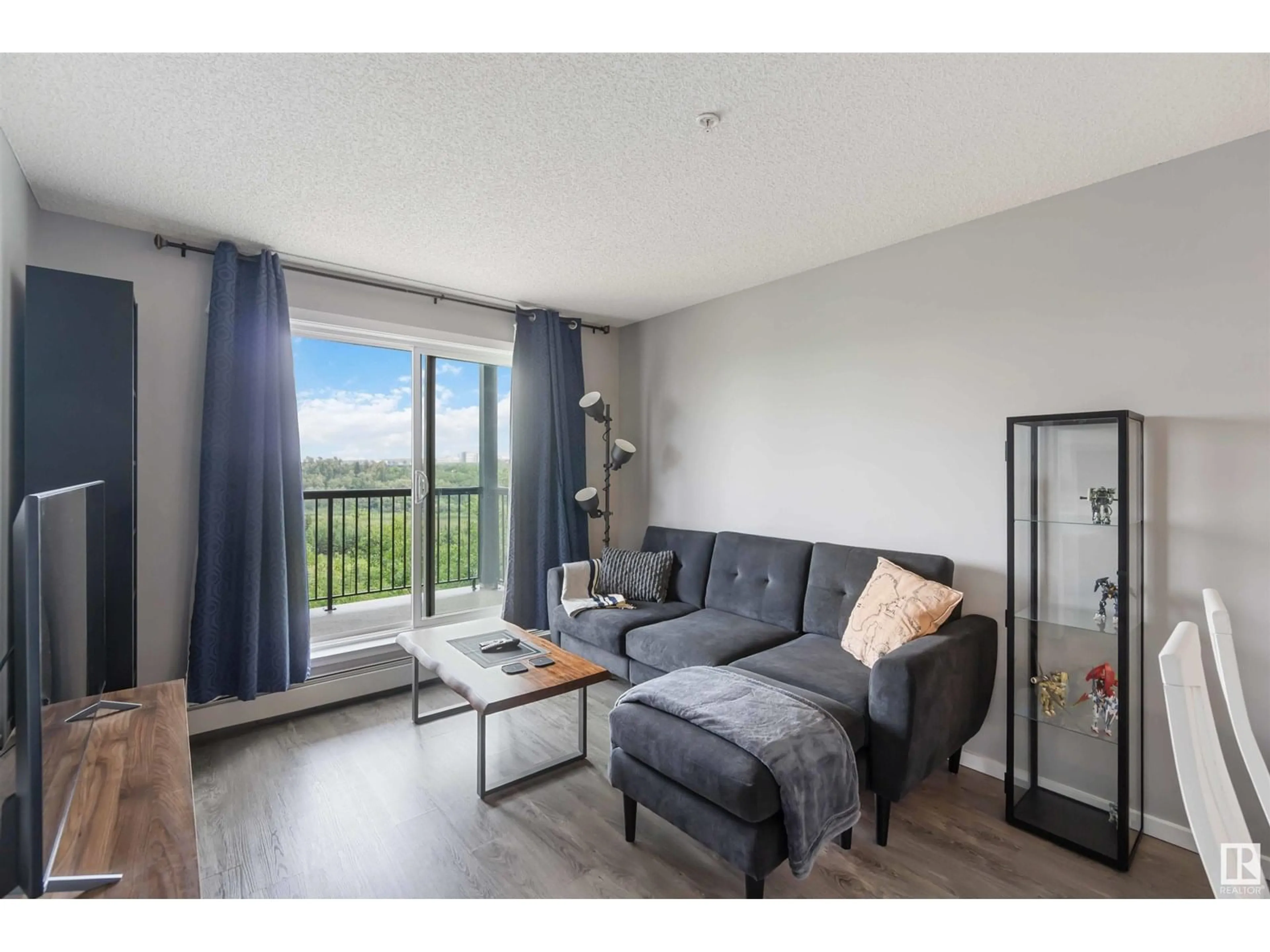 Living room with furniture, wood/laminate floor for #343 - 1196 HYNDMAN RD NW, Edmonton Alberta T5A0X8