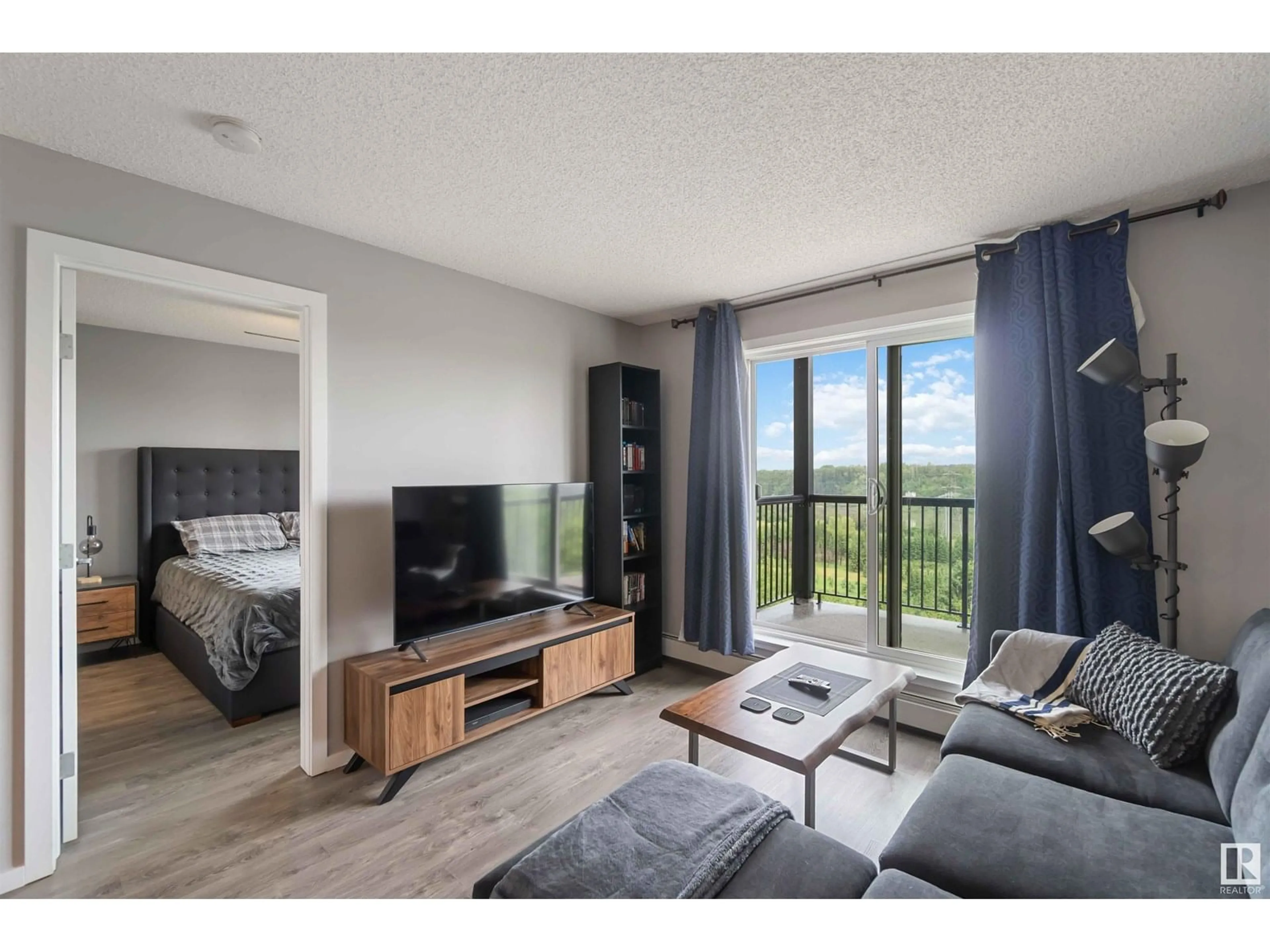 Living room with furniture, wood/laminate floor for #343 - 1196 HYNDMAN RD NW, Edmonton Alberta T5A0X8