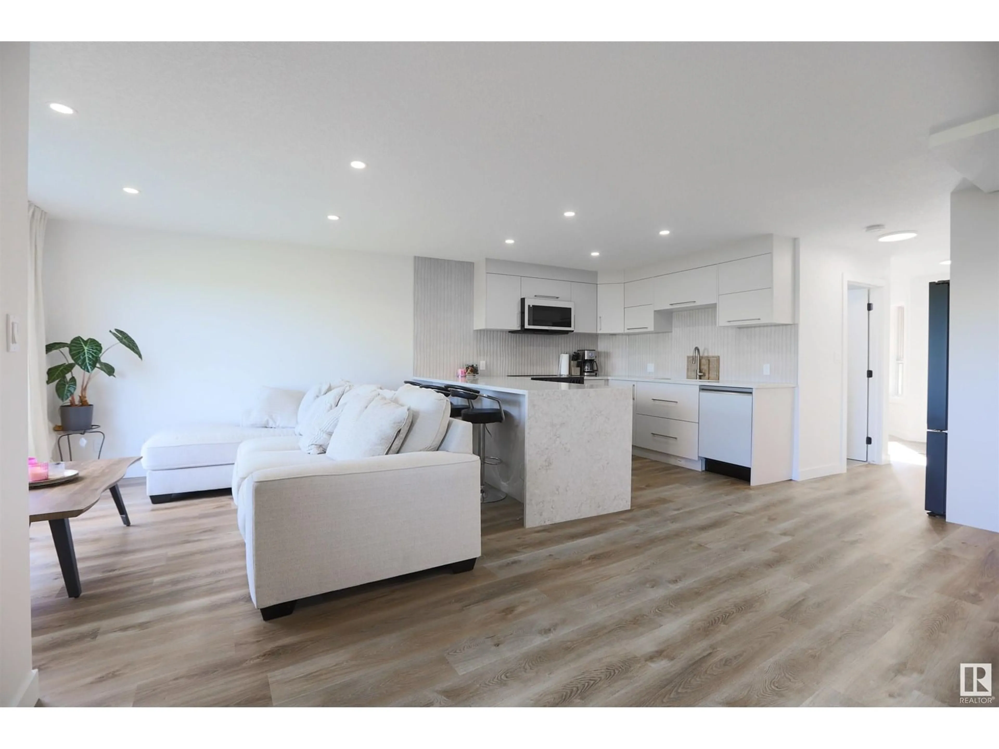 Open concept kitchen, wood/laminate floor for #108 - 10105 95 ST, Edmonton Alberta T5H4M4