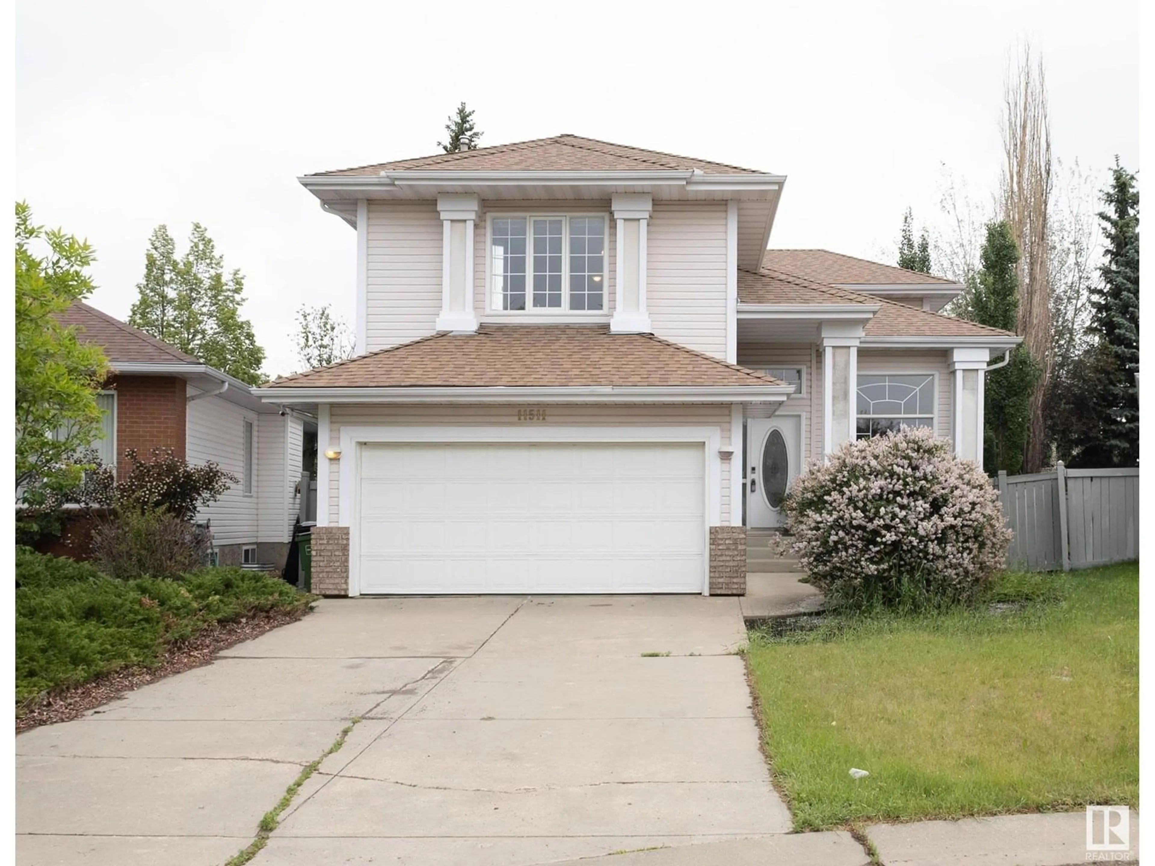 Home with vinyl exterior material, street for NW - 11511 12 AV, Edmonton Alberta T6J6X6