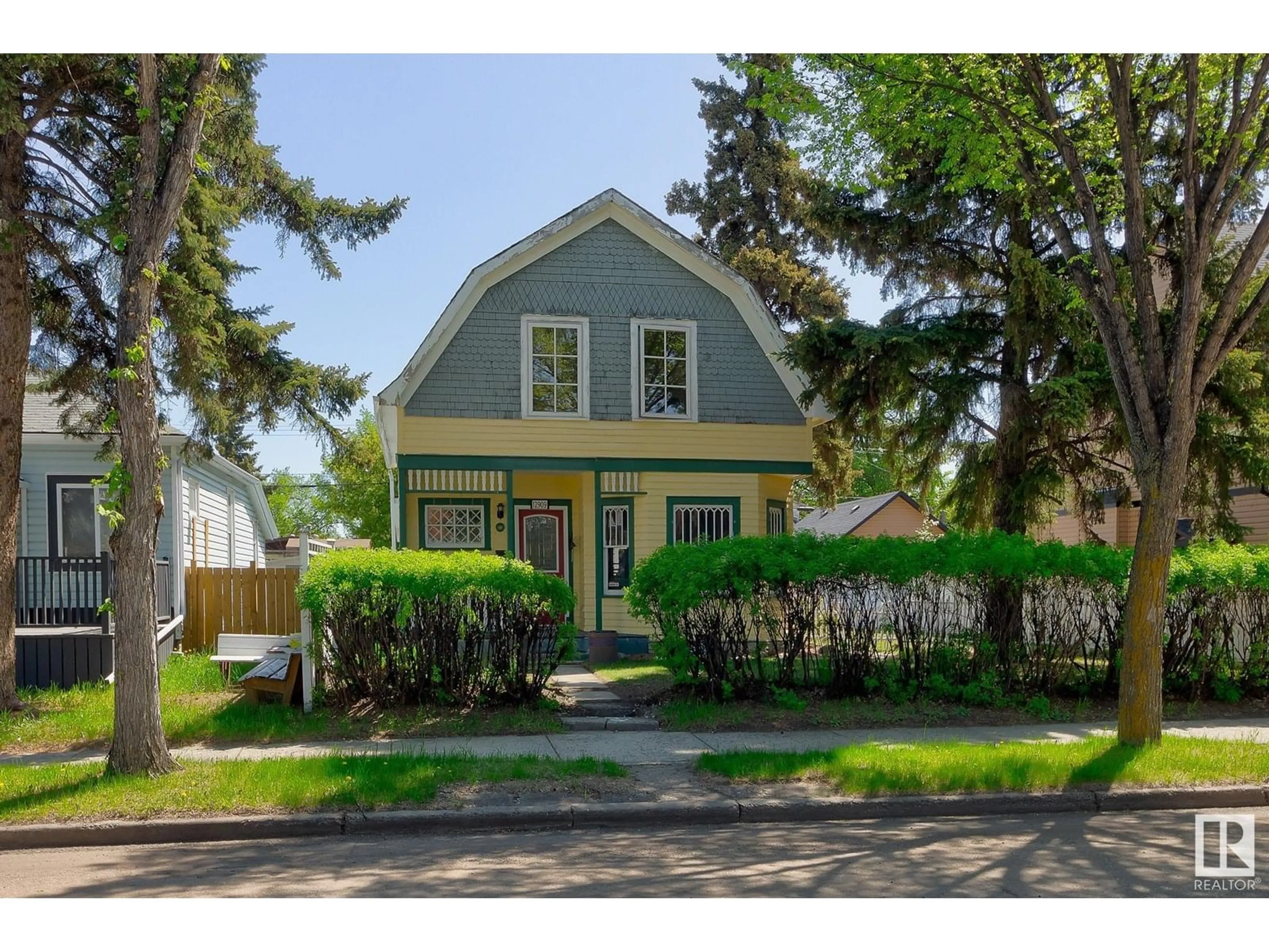 Home with vinyl exterior material, street for 12909 121 ST, Edmonton Alberta T5L0B3