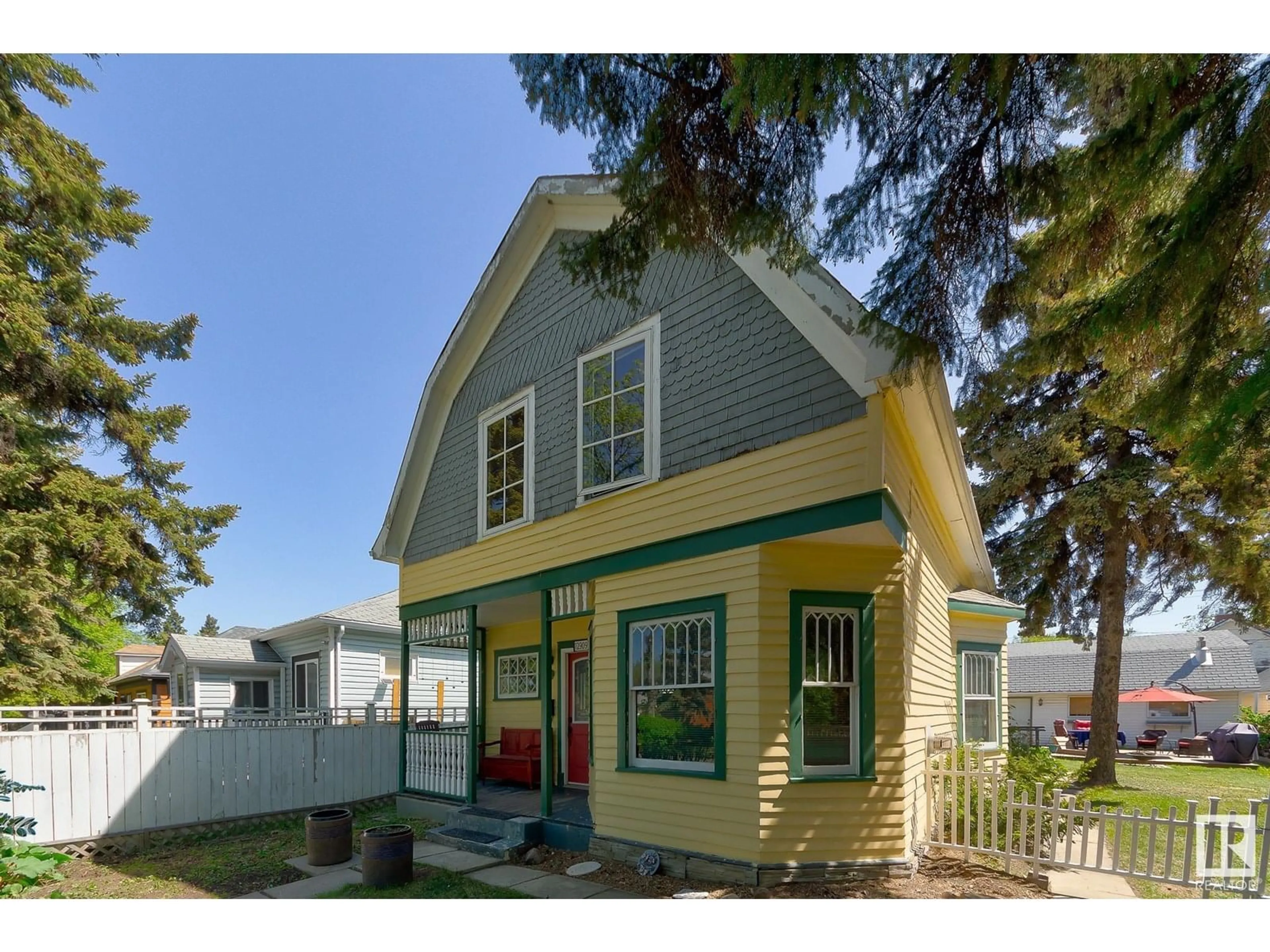 Home with vinyl exterior material, street for 12909 121 ST, Edmonton Alberta T5L0B3