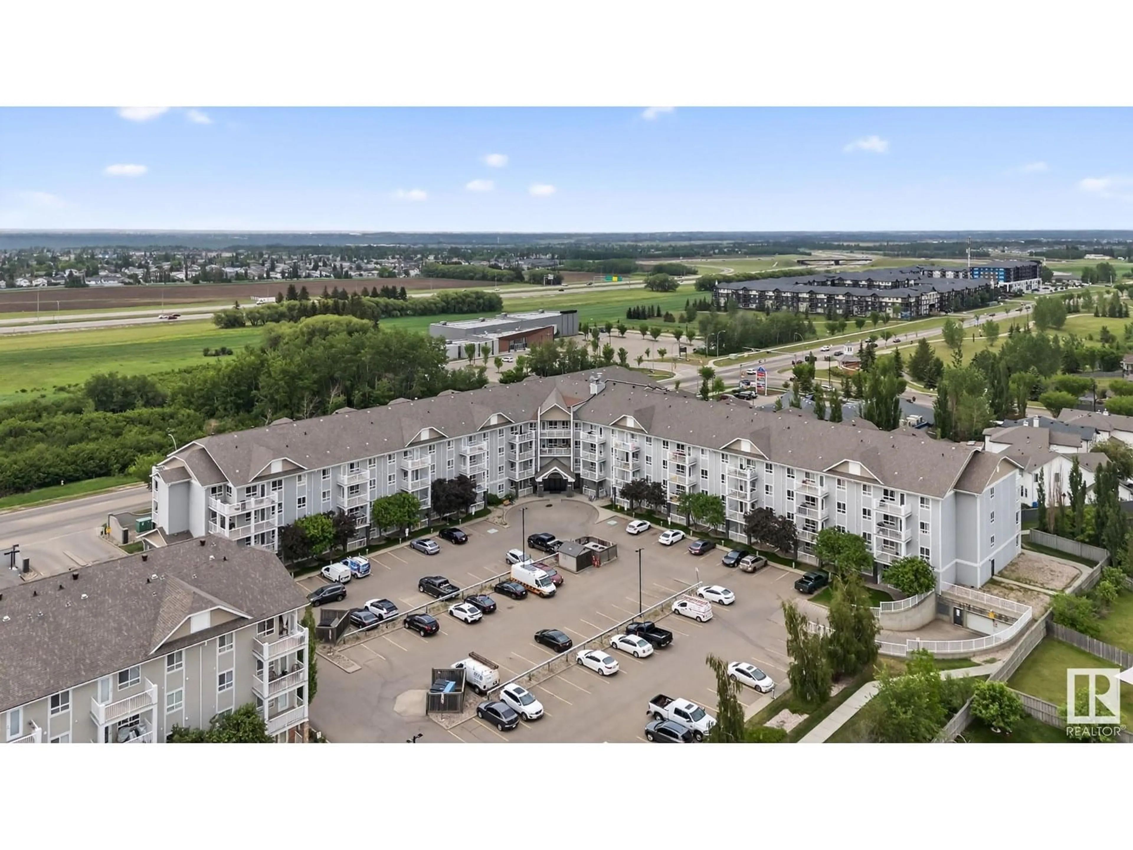 A pic from outside/outdoor area/front of a property/back of a property/a pic from drone, mountain view for #114 - 5340 199 ST, Edmonton Alberta T6M0A5