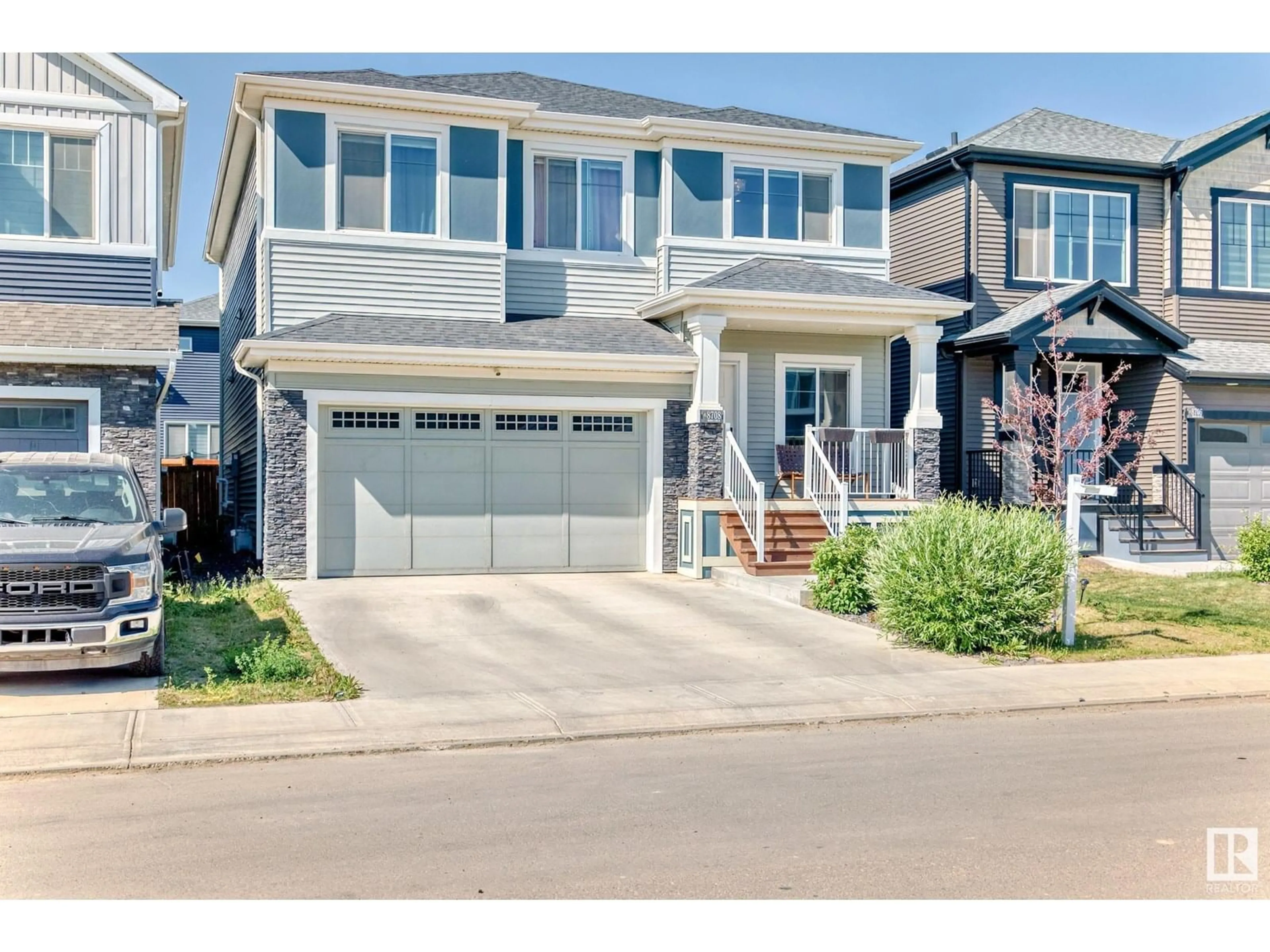 Home with vinyl exterior material, street for 8708 MAYDAY LN, Edmonton Alberta T6X2L3