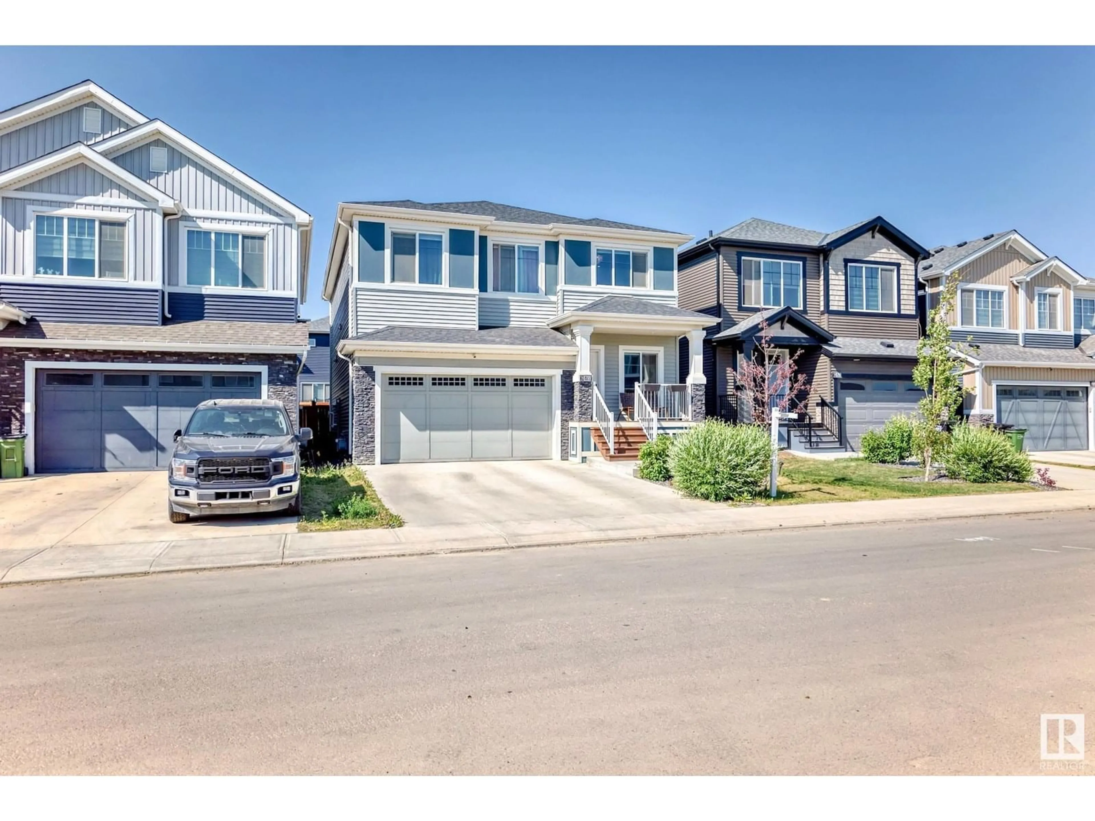Home with vinyl exterior material, street for 8708 MAYDAY LN, Edmonton Alberta T6X2L3