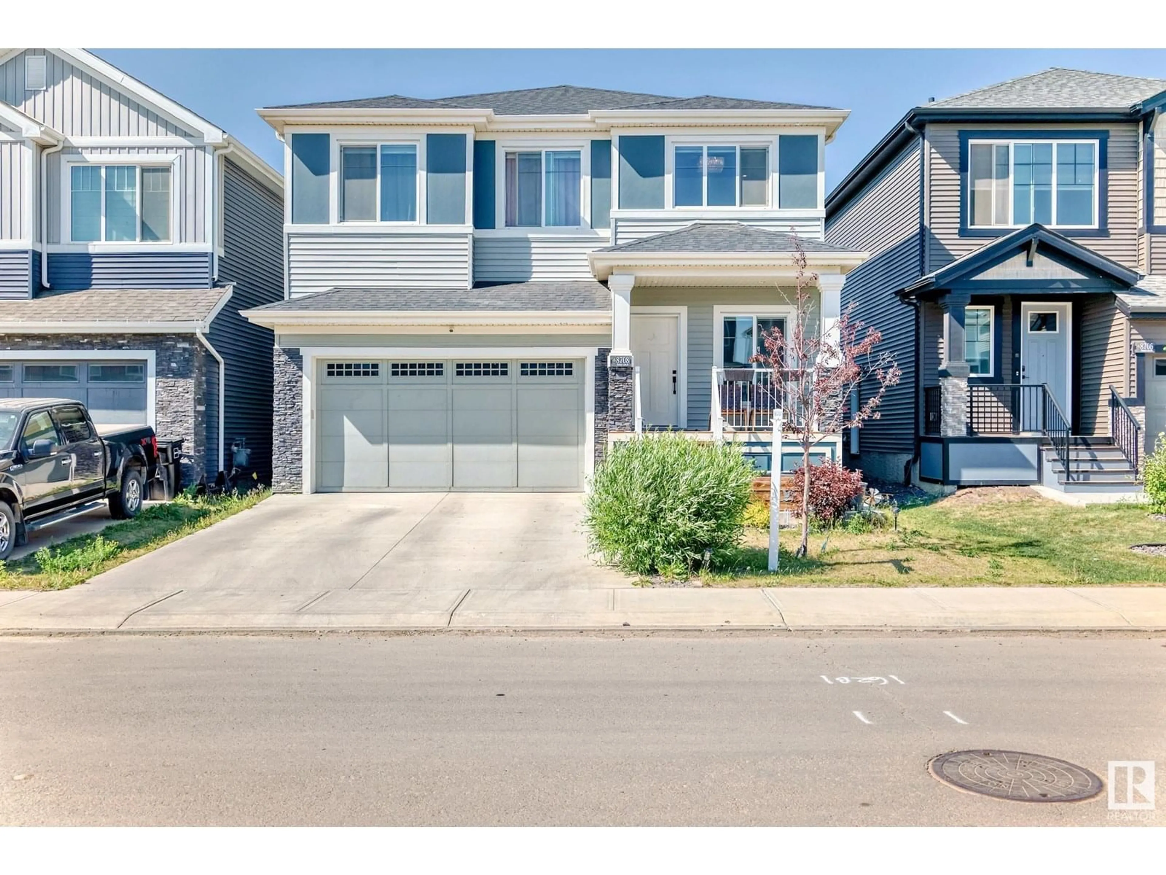 Home with vinyl exterior material, street for 8708 MAYDAY LN, Edmonton Alberta T6X2L3