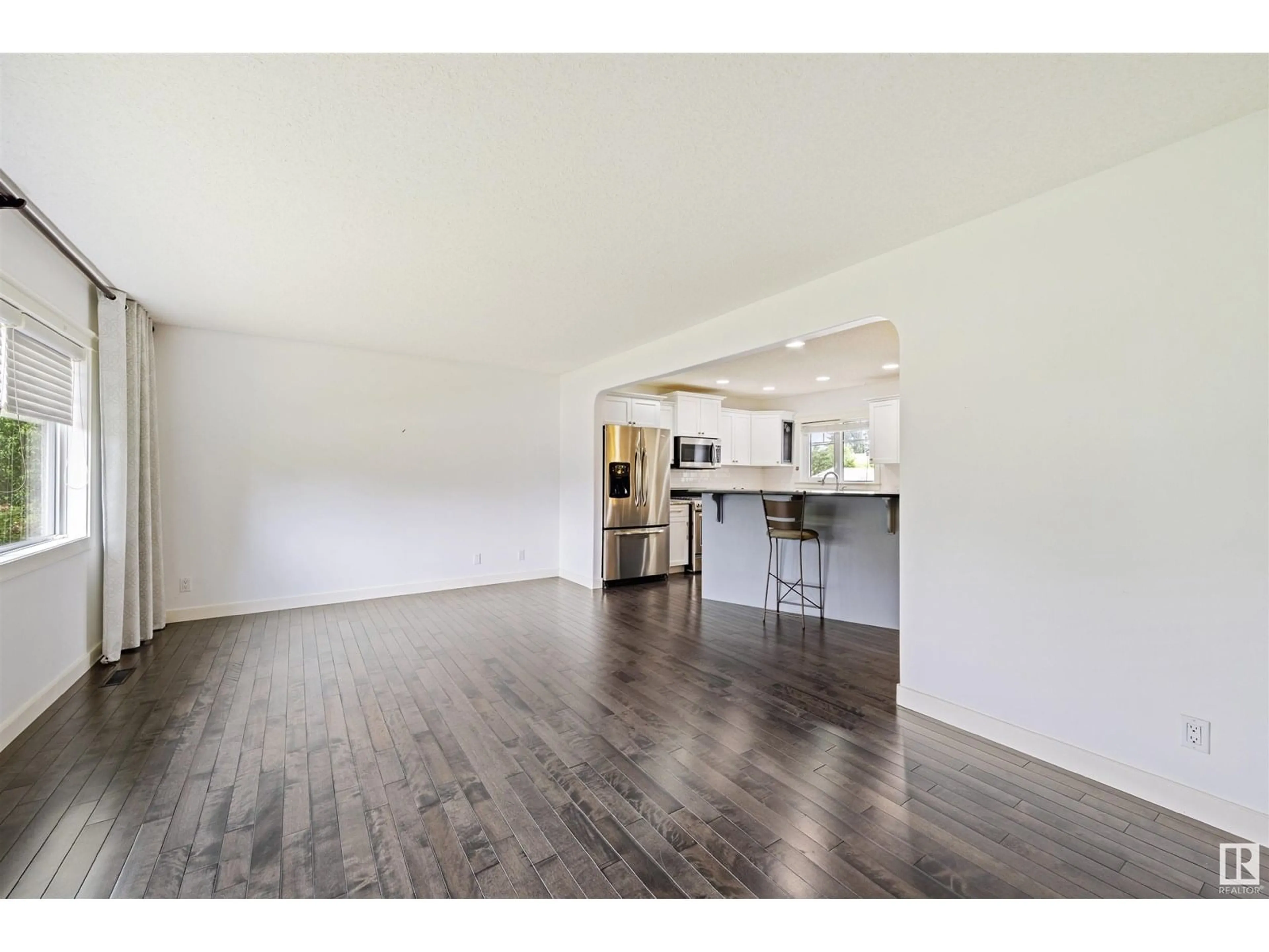 Open concept kitchen, wood/laminate floor for 8943 146A ST, Edmonton Alberta T5R0X2