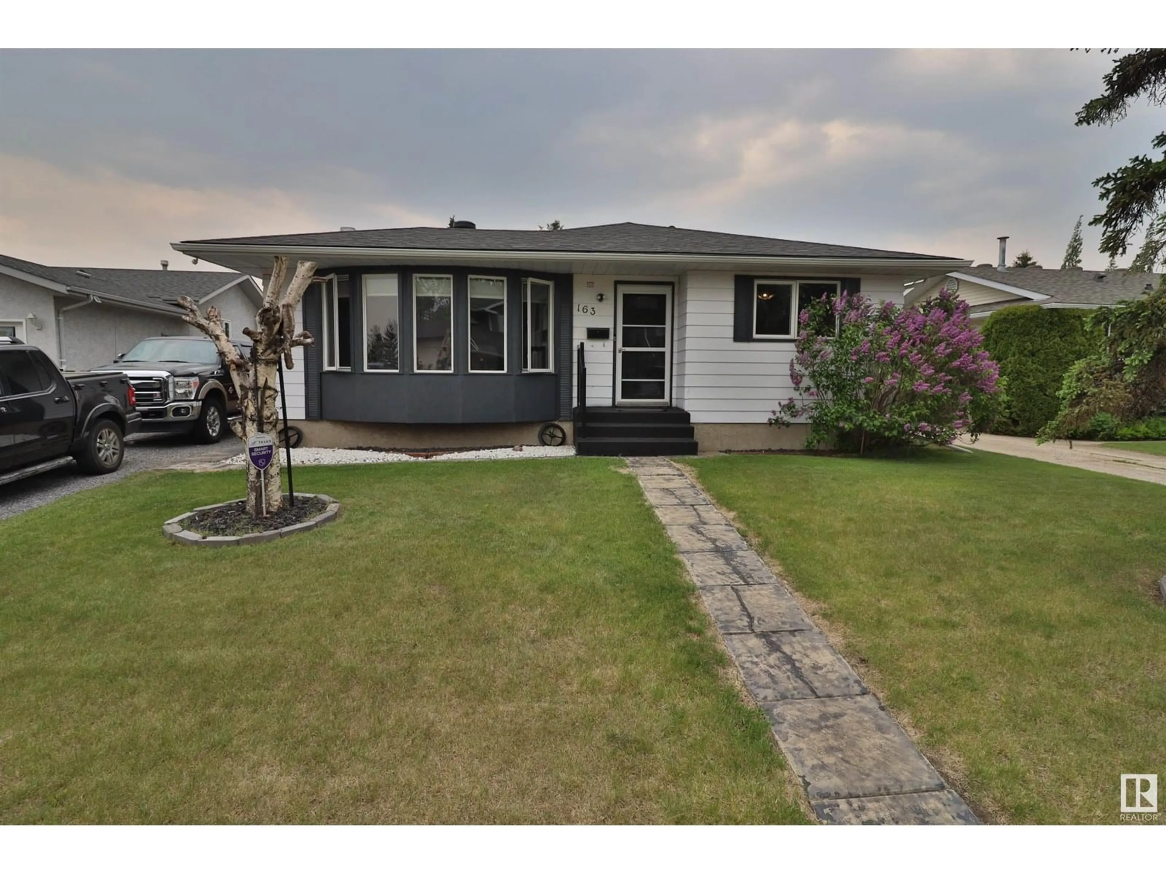 Home with vinyl exterior material, street for 163 GARWOOD CRST, Wetaskiwin Alberta T9A2X4