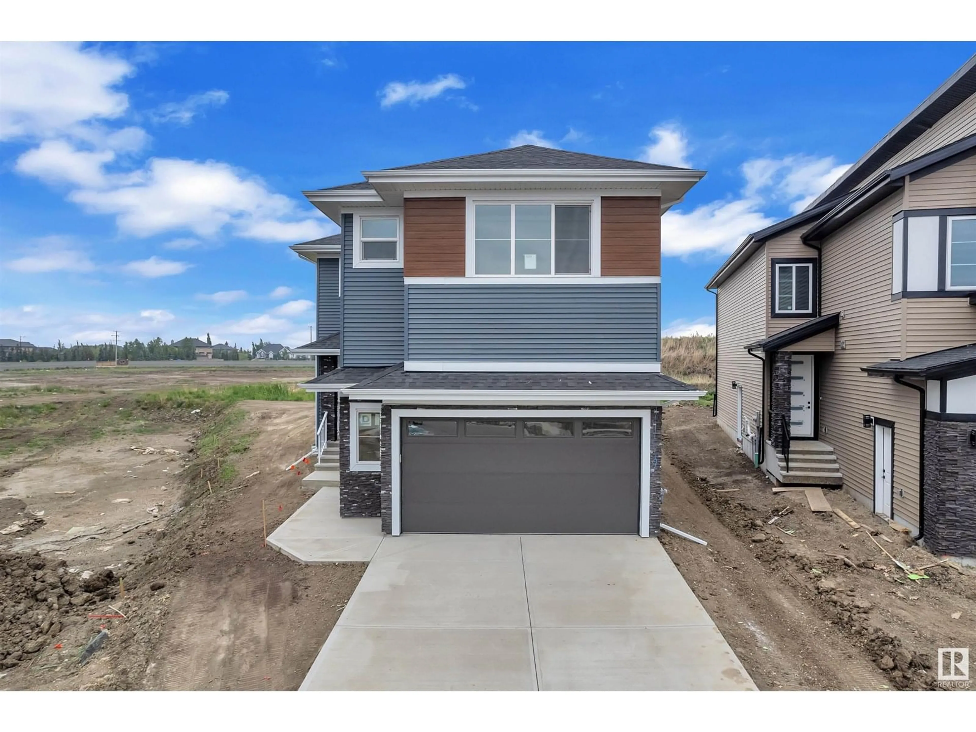 Home with vinyl exterior material, street for NE - 6209 19 ST, Rural Leduc County Alberta T4X3C8