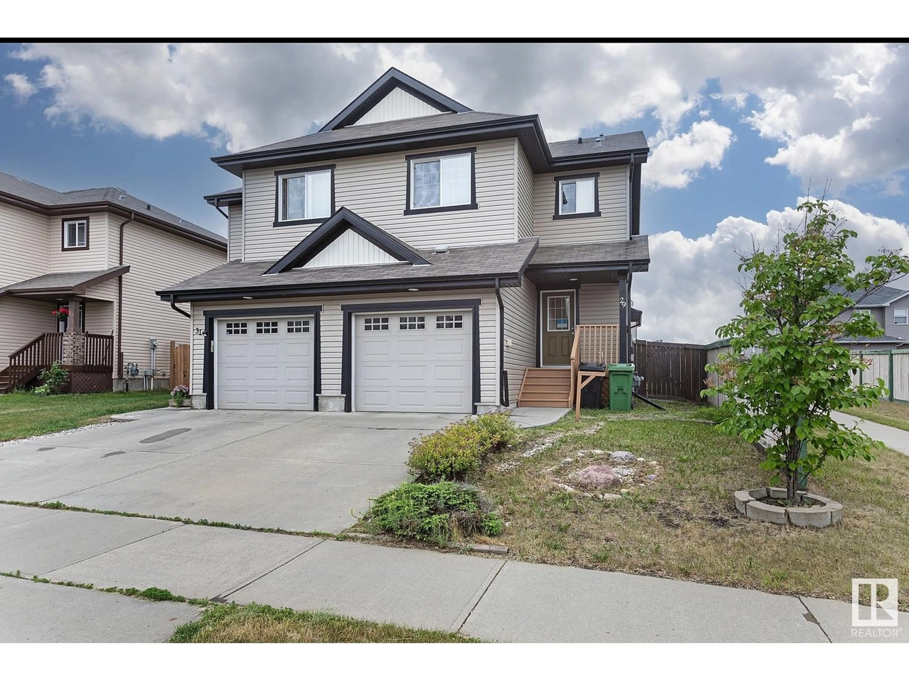 Home with vinyl exterior material, street for 29 CARAGANA WY, Fort Saskatchewan Alberta T6L0H8