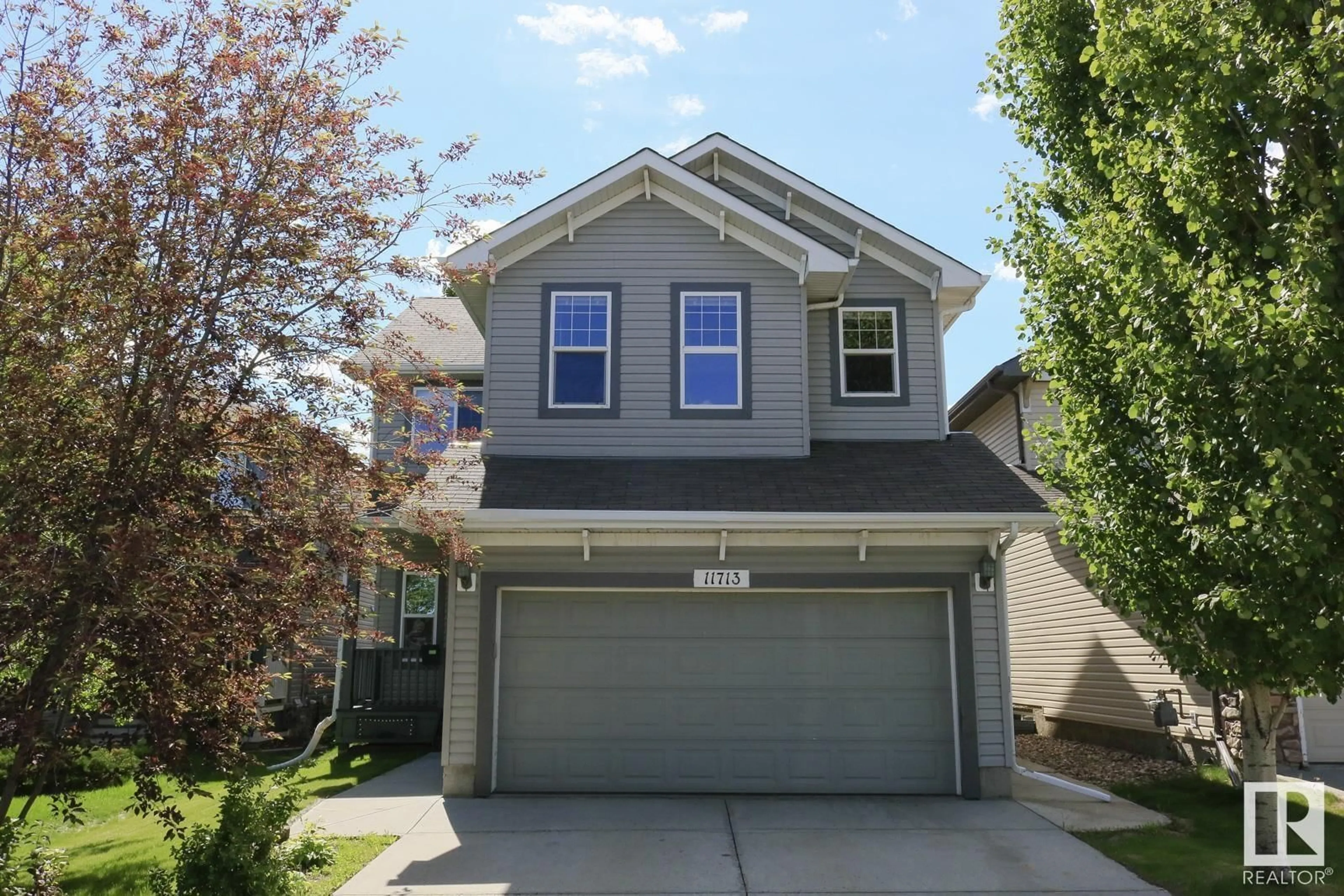 Home with vinyl exterior material, street for 11713 13A AV SW, Edmonton Alberta T6W0E6