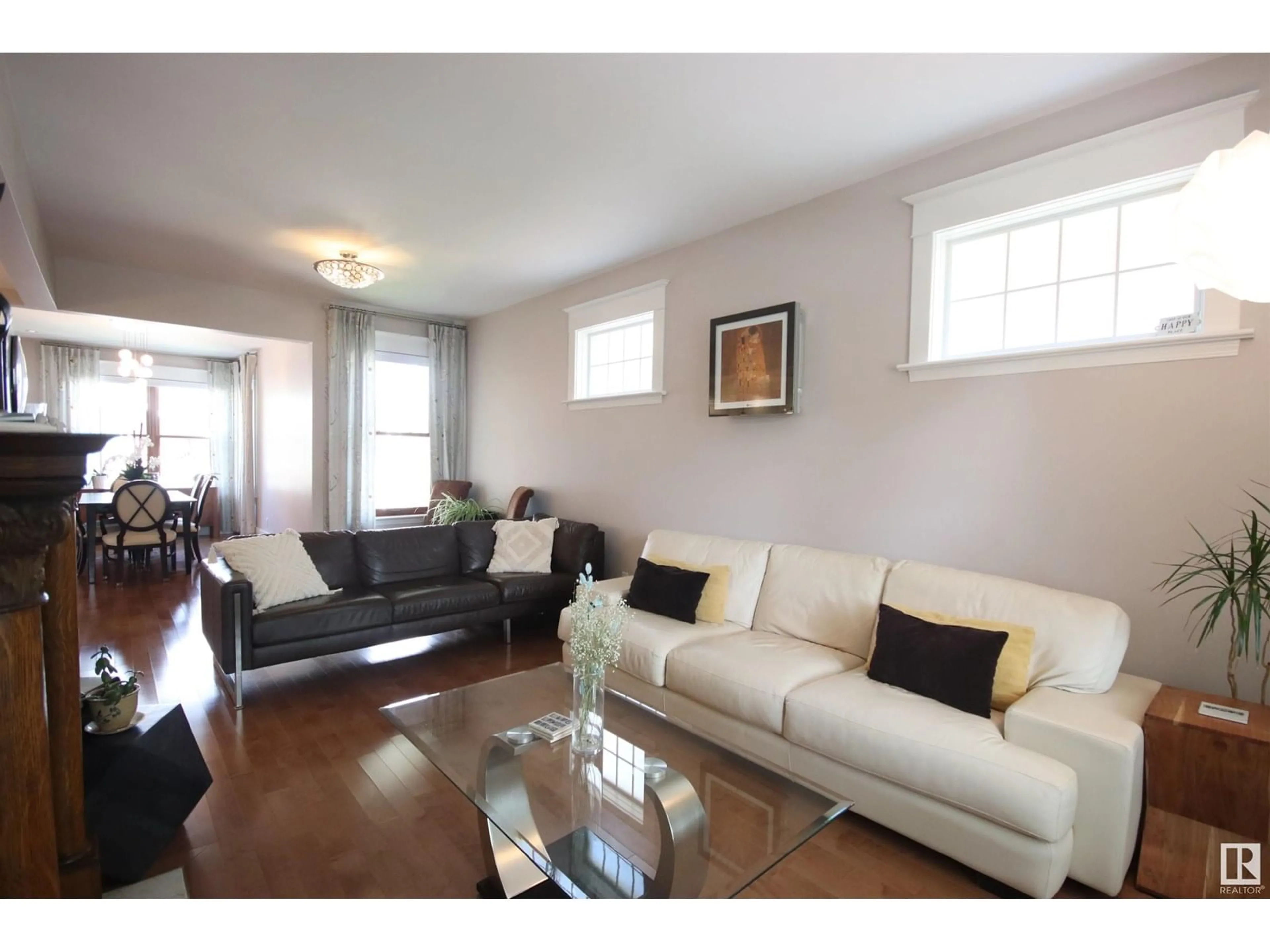 Living room with furniture, wood/laminate floor for 10944 89 AV, Edmonton Alberta T6G0Z5