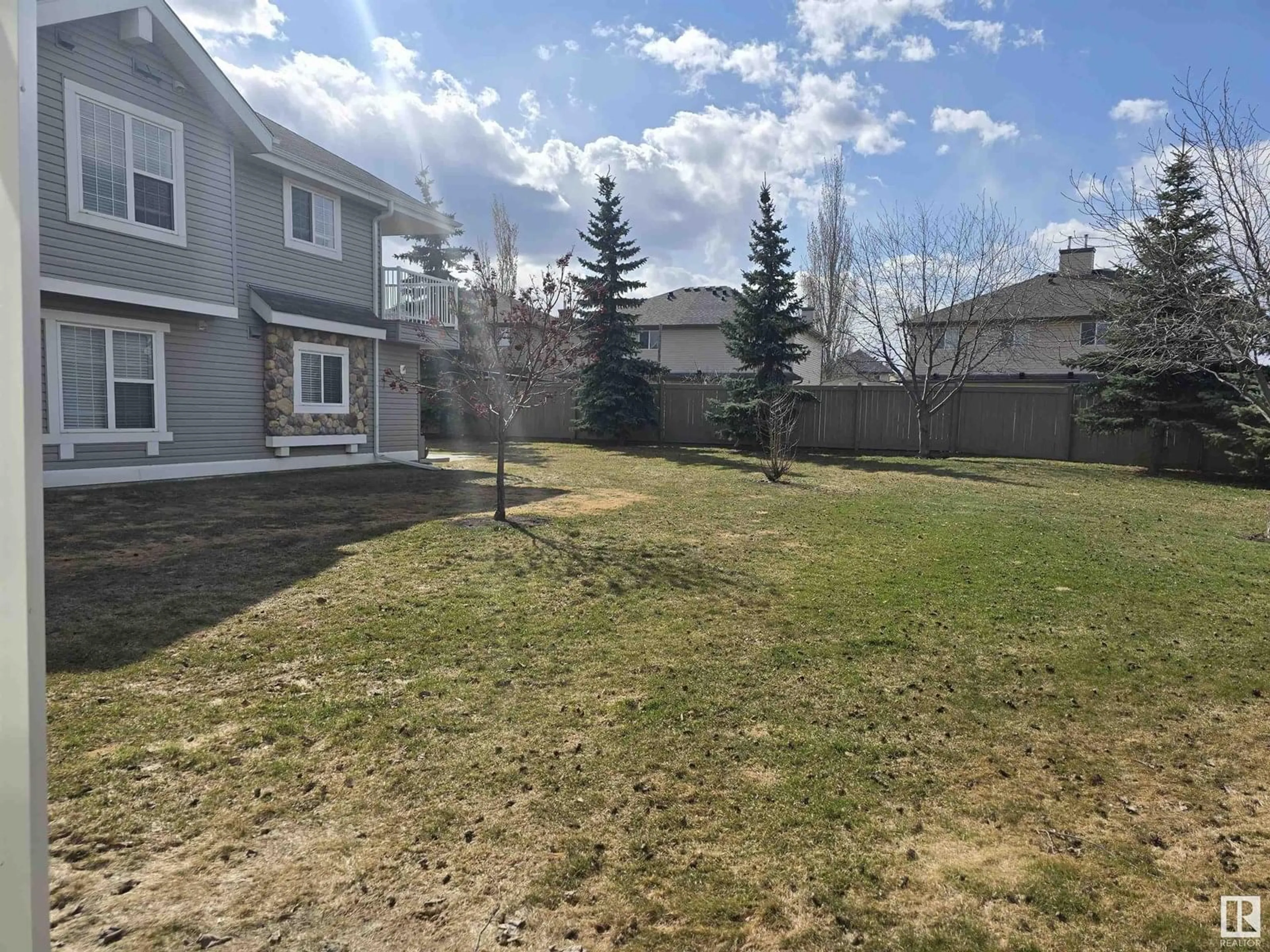 A pic from outside/outdoor area/front of a property/back of a property/a pic from drone, mountain view for SW - 48 150 EDWARDS DR, Edmonton Alberta T6X1M4