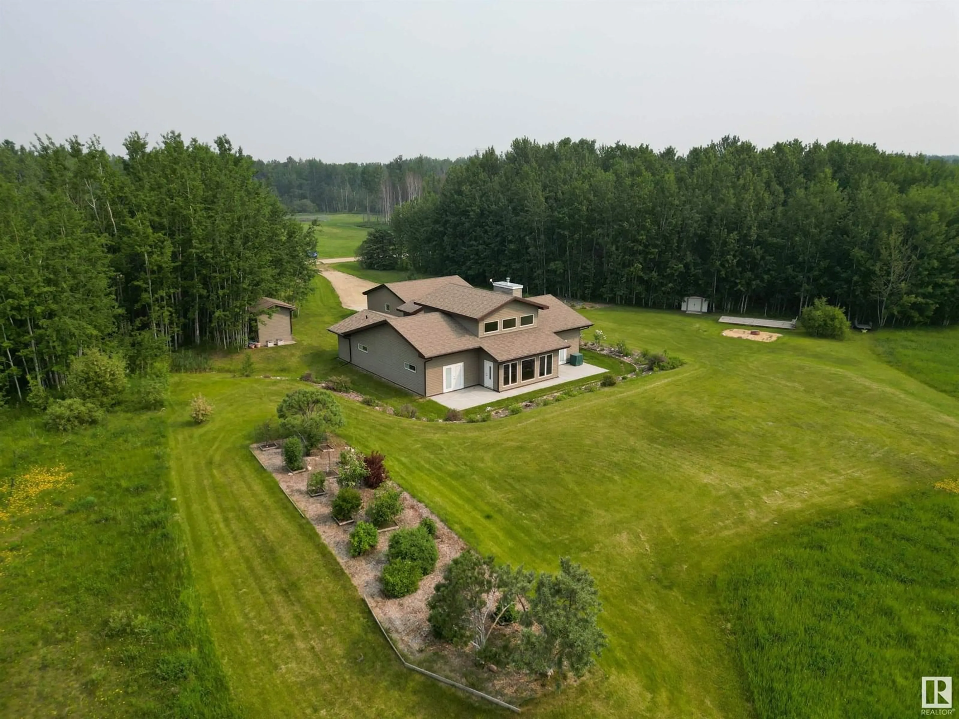 A pic from outside/outdoor area/front of a property/back of a property/a pic from drone, unknown for 4021 - 27 TWP ROAD 540, Rural Lac Ste. Anne County Alberta T0E0A1