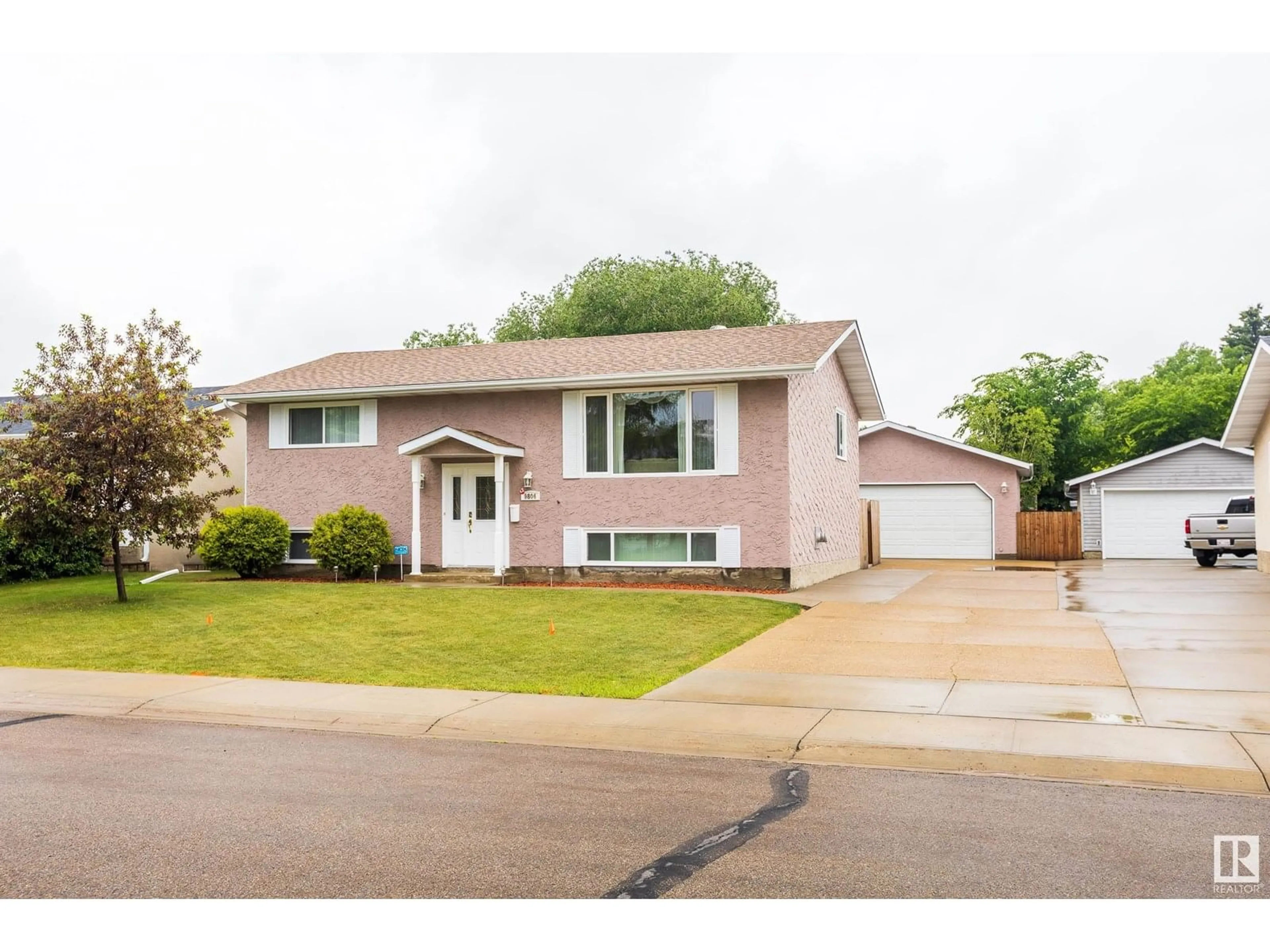 Home with vinyl exterior material, street for 9806 98 ST, Morinville Alberta T8R1G8
