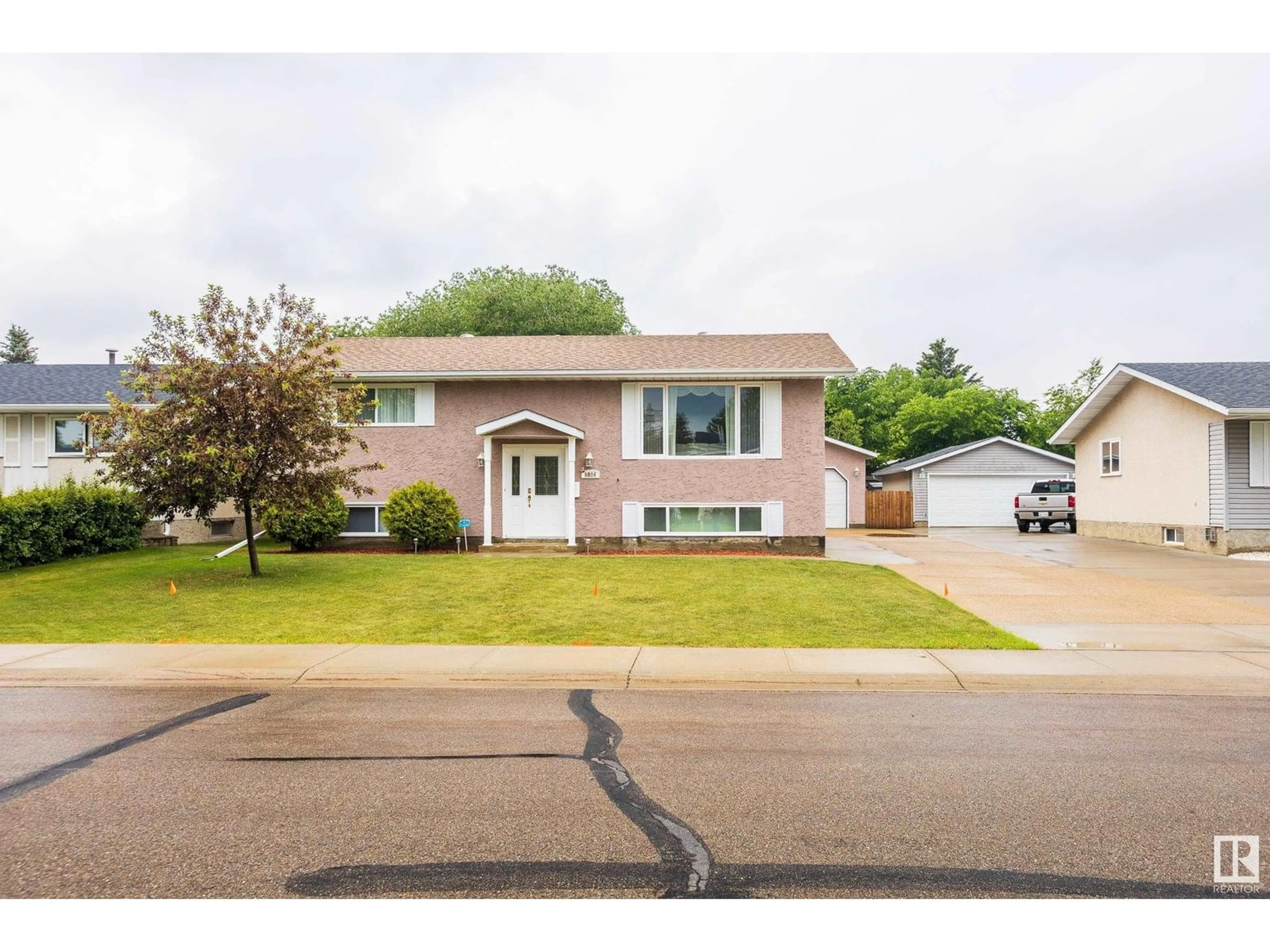 Home with vinyl exterior material, street for 9806 98 ST, Morinville Alberta T8R1G8