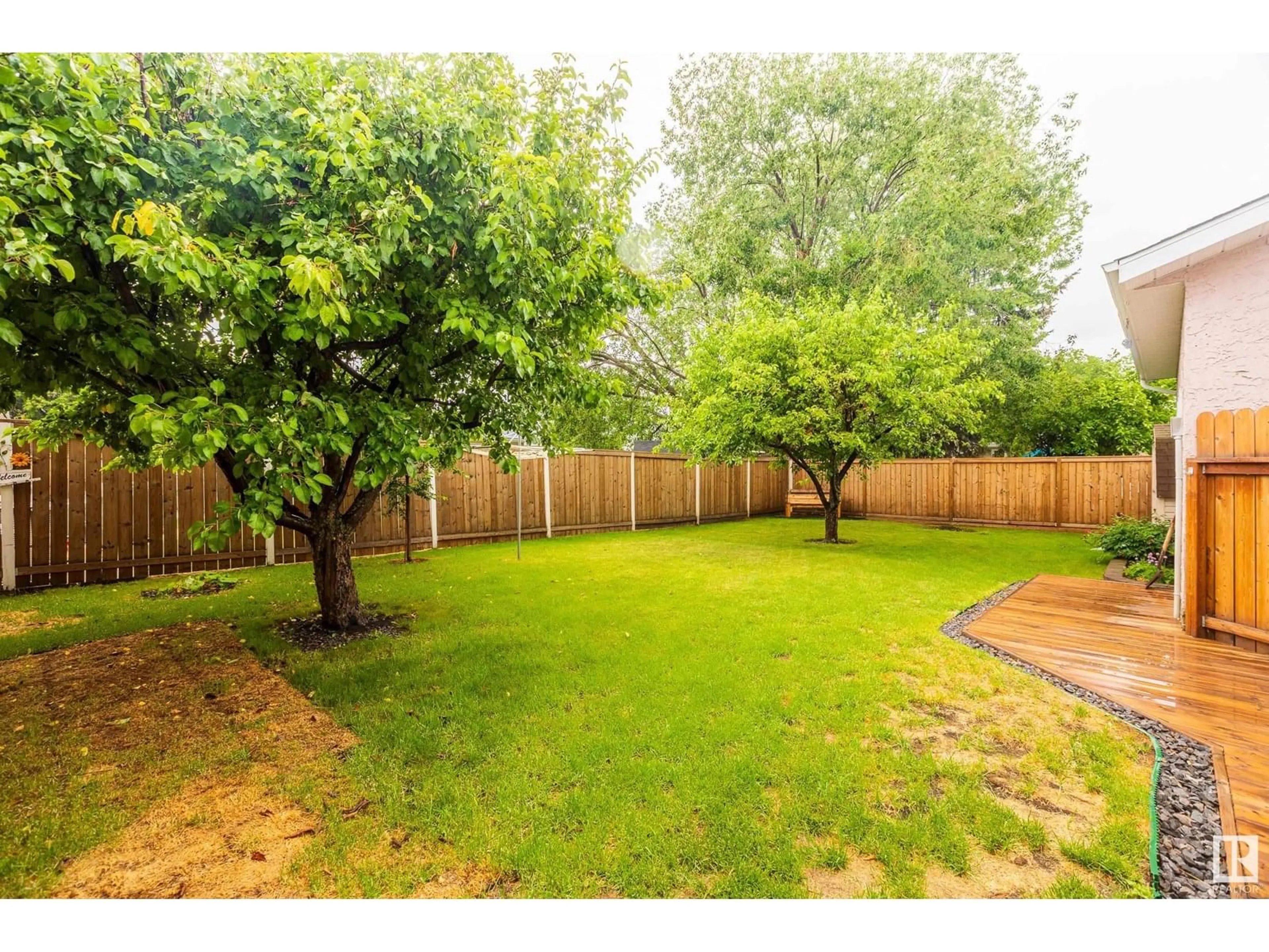 A pic from outside/outdoor area/front of a property/back of a property/a pic from drone, forest/trees view for 9806 98 ST, Morinville Alberta T8R1G8