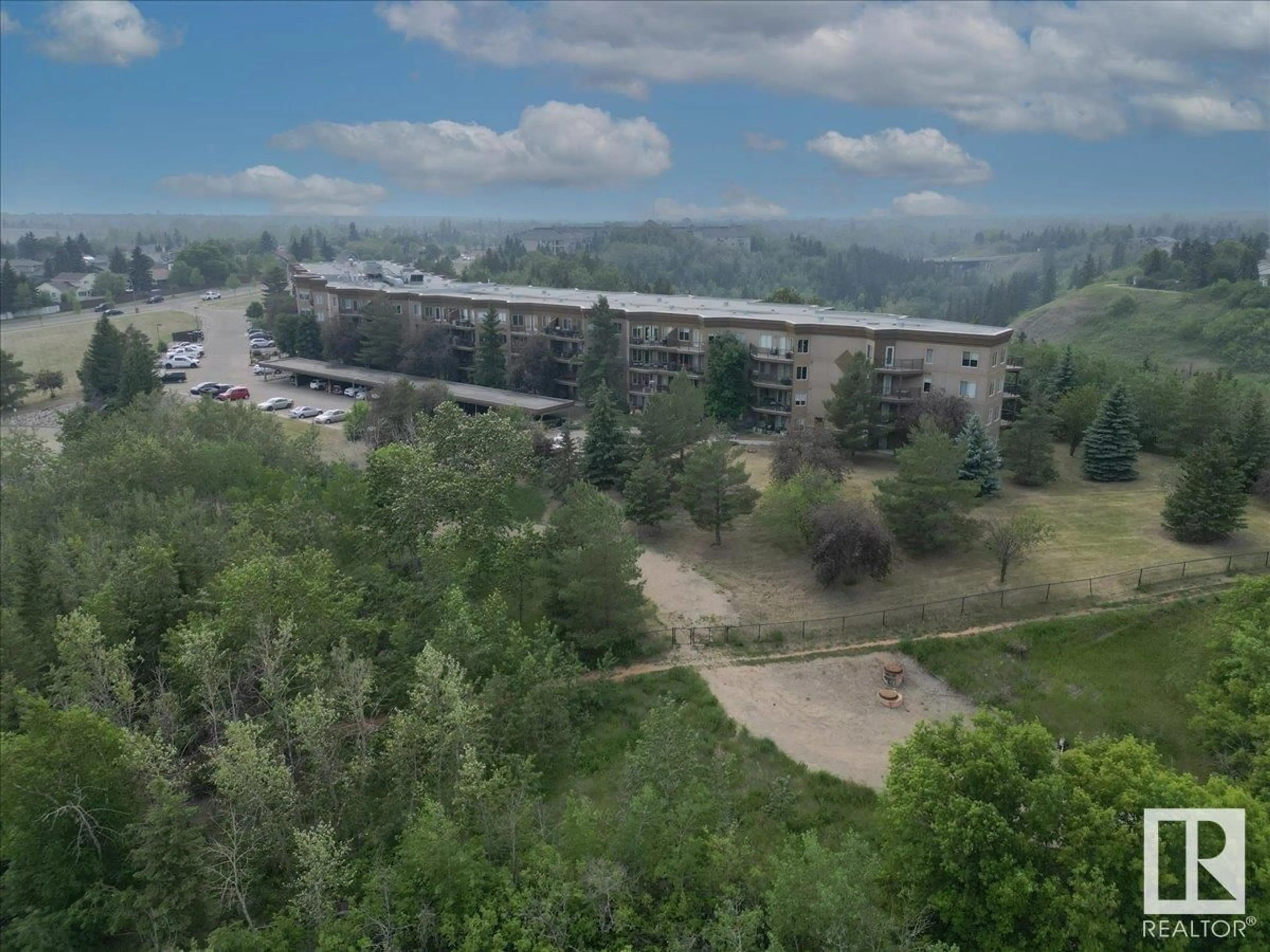 A pic from outside/outdoor area/front of a property/back of a property/a pic from drone, mountain view for #315 - 530 HOOKE RD, Edmonton Alberta T5A5J5