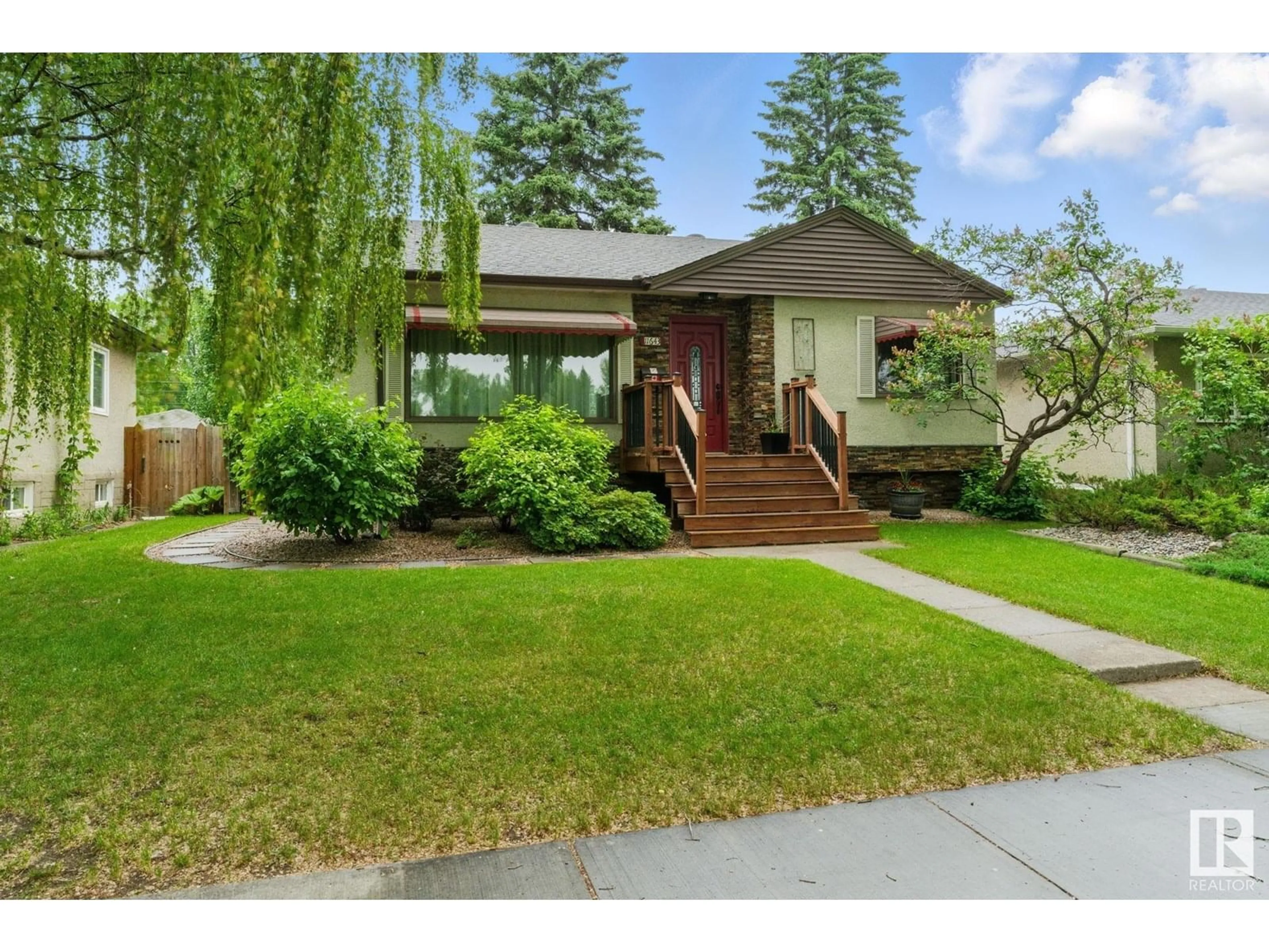 Home with vinyl exterior material, street for 11643 137 ST, Edmonton Alberta T5M1N8