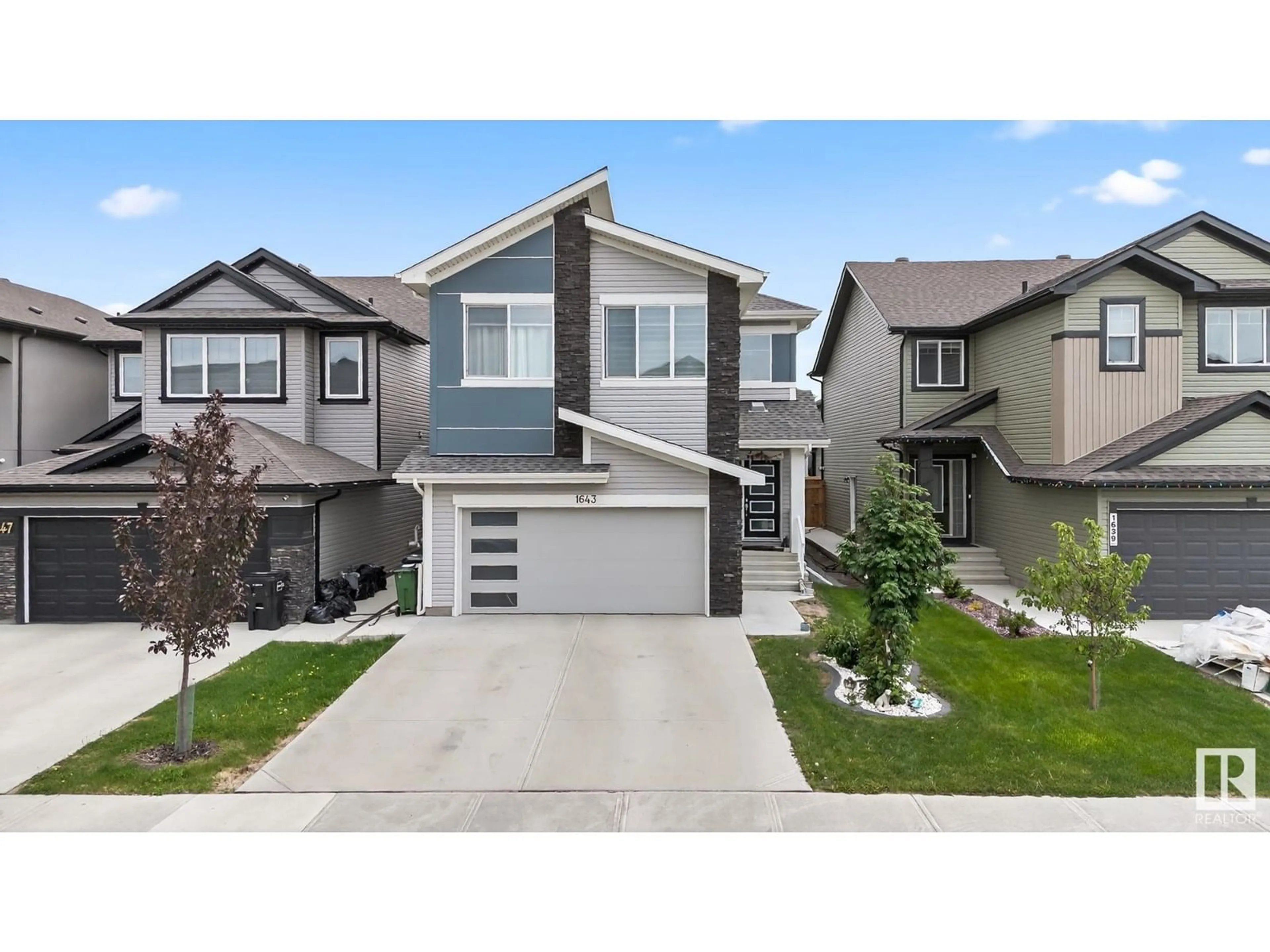 Home with vinyl exterior material, street for 1643 14 ST, Edmonton Alberta T6T2N6