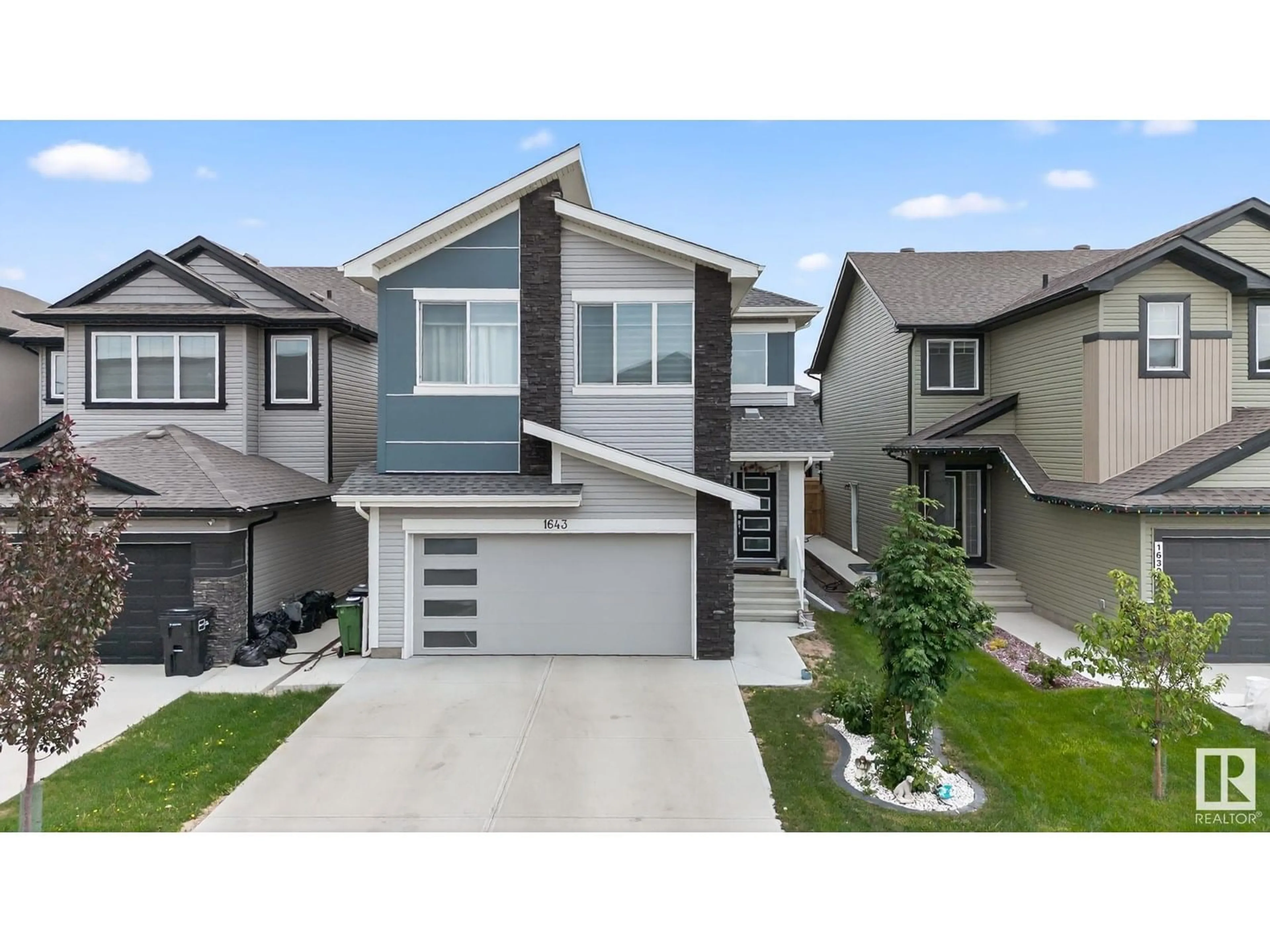 Home with vinyl exterior material, street for 1643 14 ST, Edmonton Alberta T6T2N6