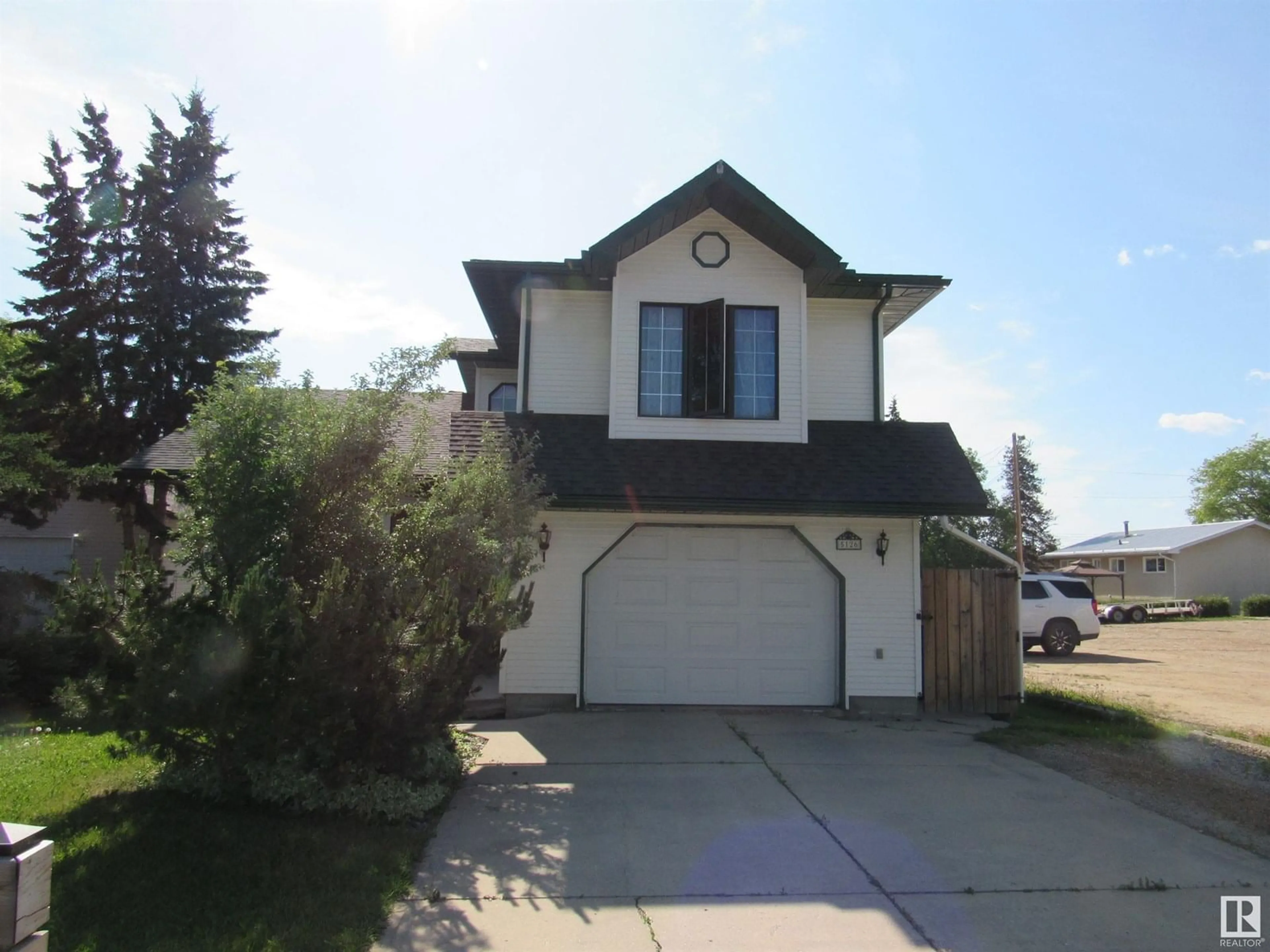 Home with vinyl exterior material, street for 5126 46 STREET, Barrhead Alberta T7N1H8