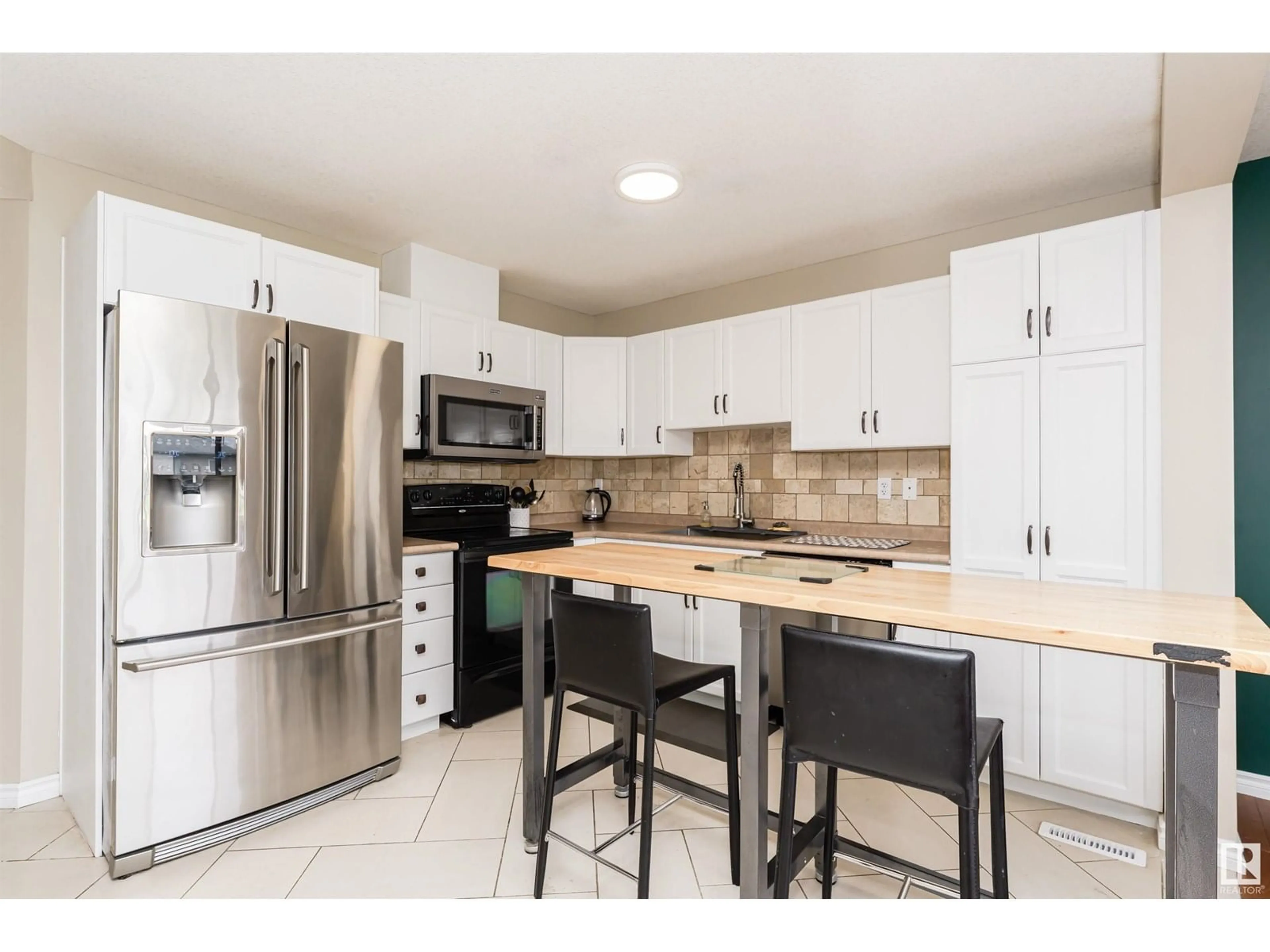 Open concept kitchen, ceramic/tile floor for #31 - 2816 34 AV, Edmonton Alberta T6T2B4